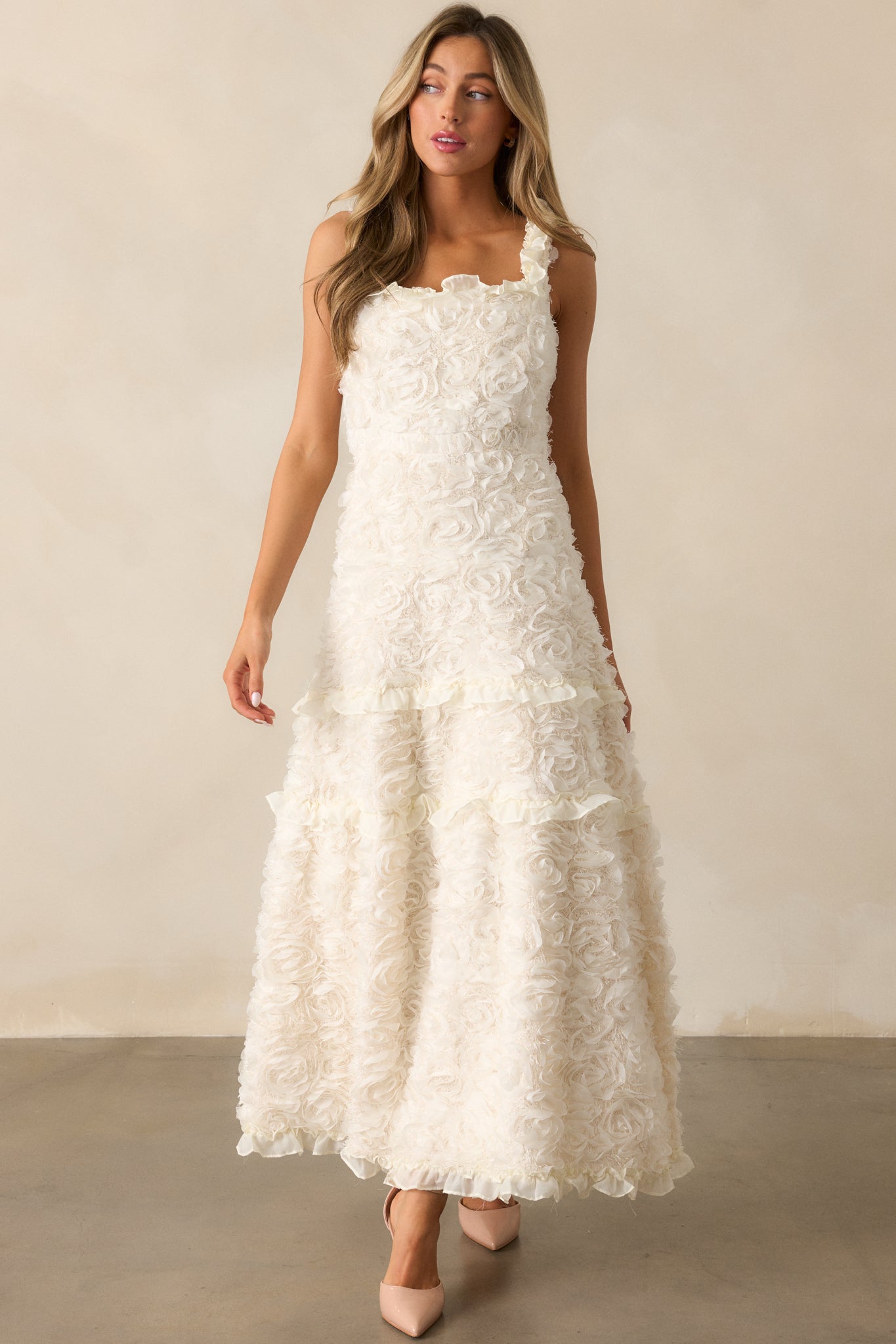 Another full-length view of the ivory dress, emphasizing the tiered ruffle skirt and ruffle hem details for a layered, elegant look.