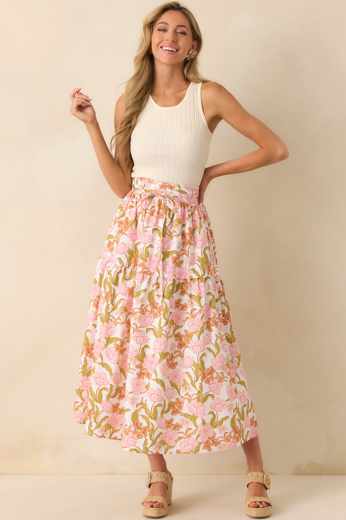 Full length shot highlighting the tiered structure of the skirt and the adjustable self-tie belt at the waist.