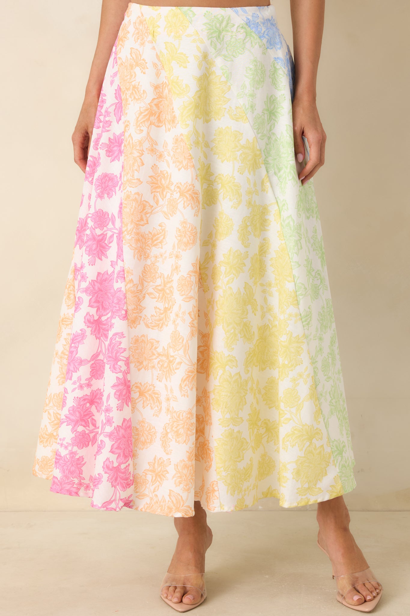 Full silhouette and fabric movement highlighting airy cotton linen blend and vibrant floral design.