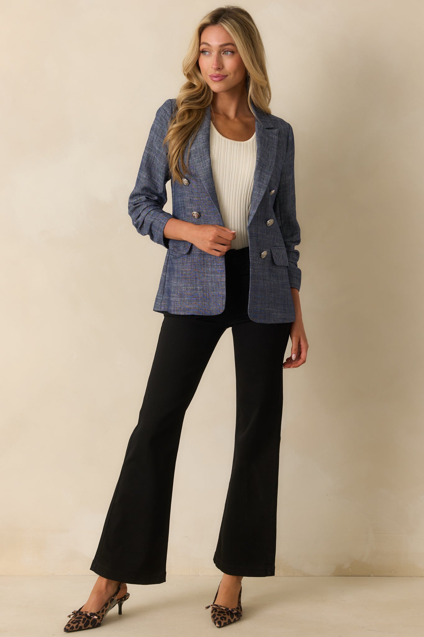 Another full-length view capturing the blazer's structured silhouette and overall length.