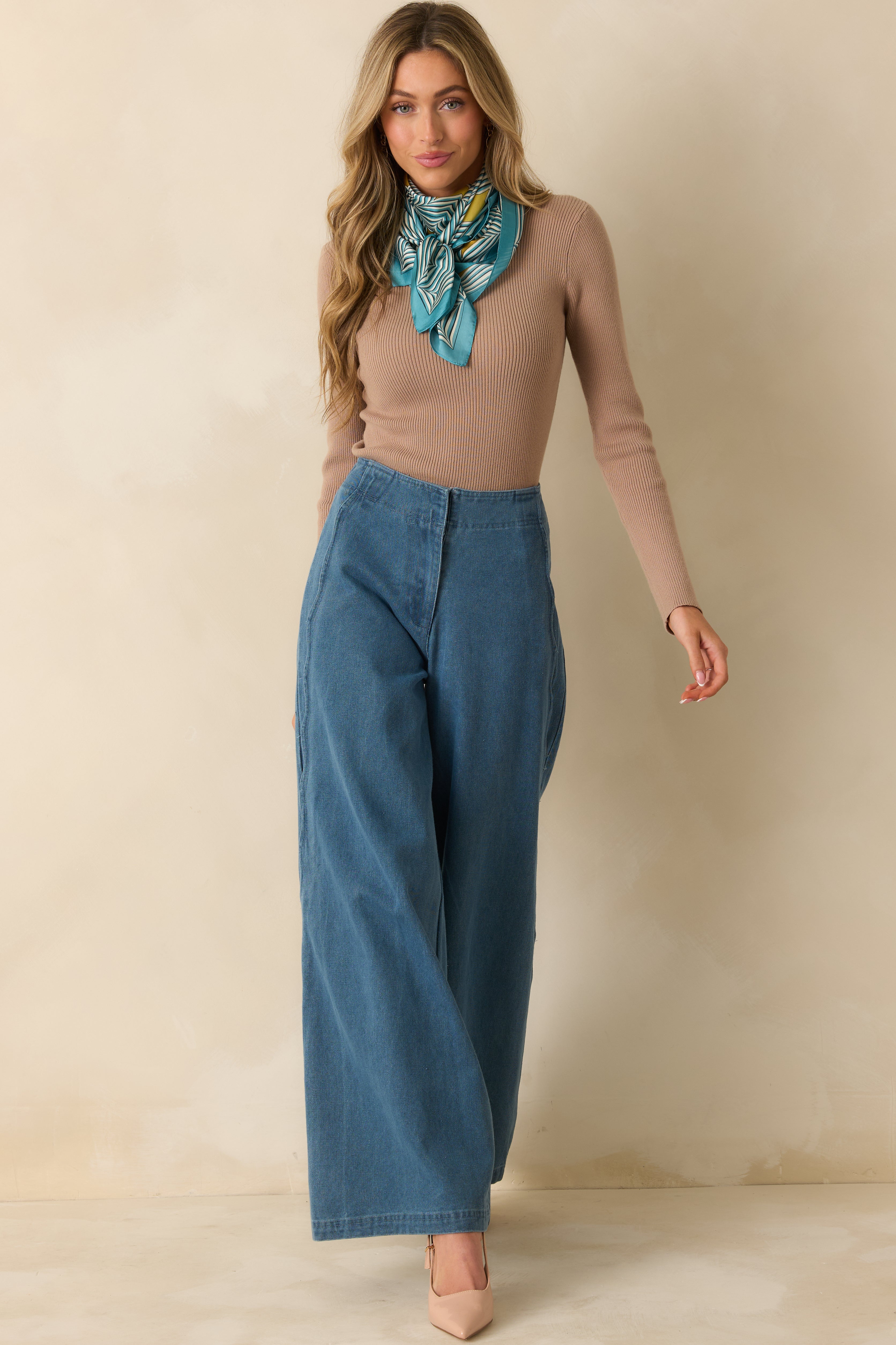 Full view highlighting the wide leg fit and smooth drape of the denim with a clean finish.