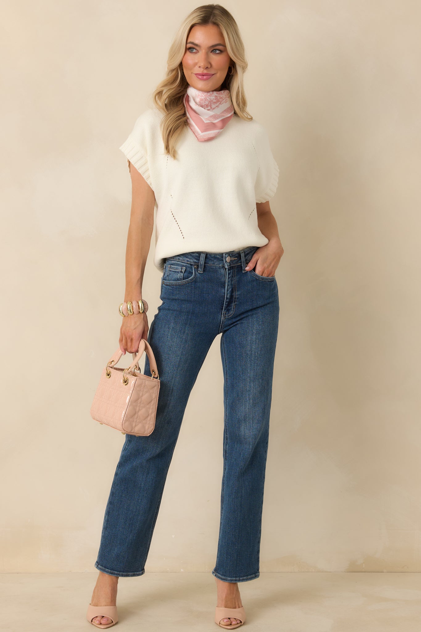 Full body front view emphasizing the clean ivory color and slightly cropped, boxy fit.