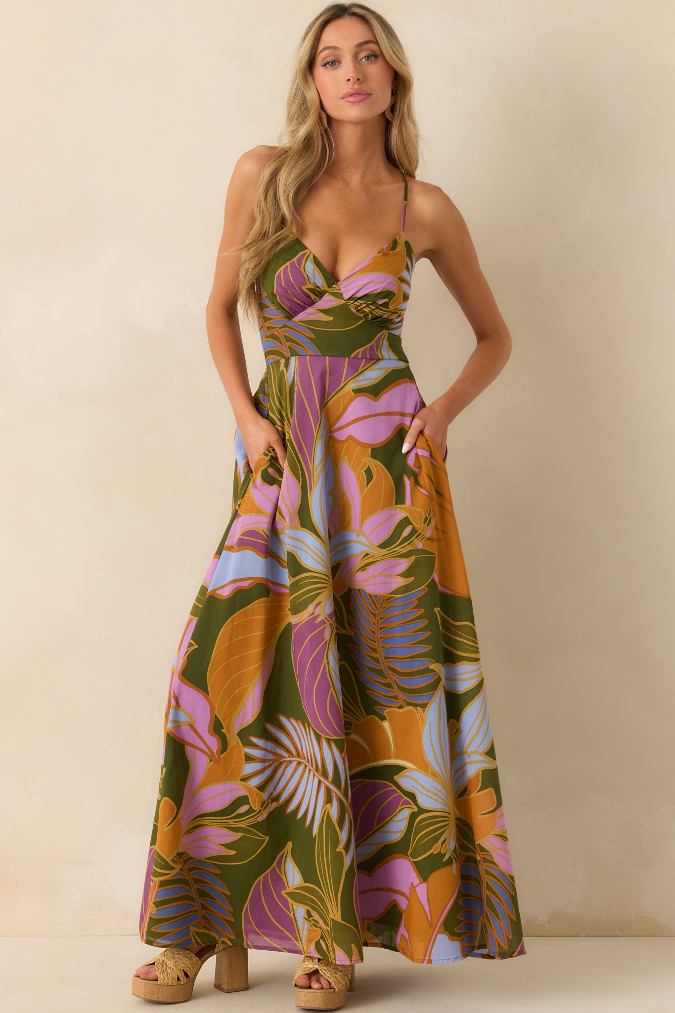 Full body view focusing on the rich olive tone, multicolor floral pattern, and relaxed skirt silhouette.