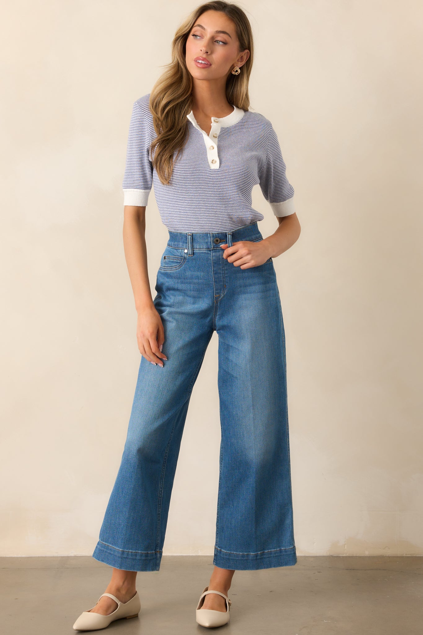 Angled front full-length view of the jeans highlighting the flattering high-rise cut and sleek silhouette.