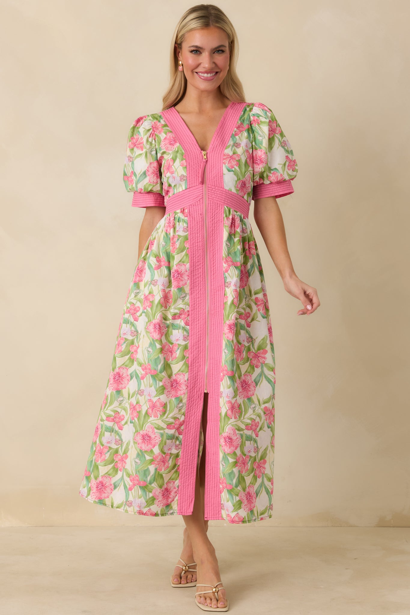 Full-length view highlighting zip-front closure, flowing midi skirt, and subtle front slit.