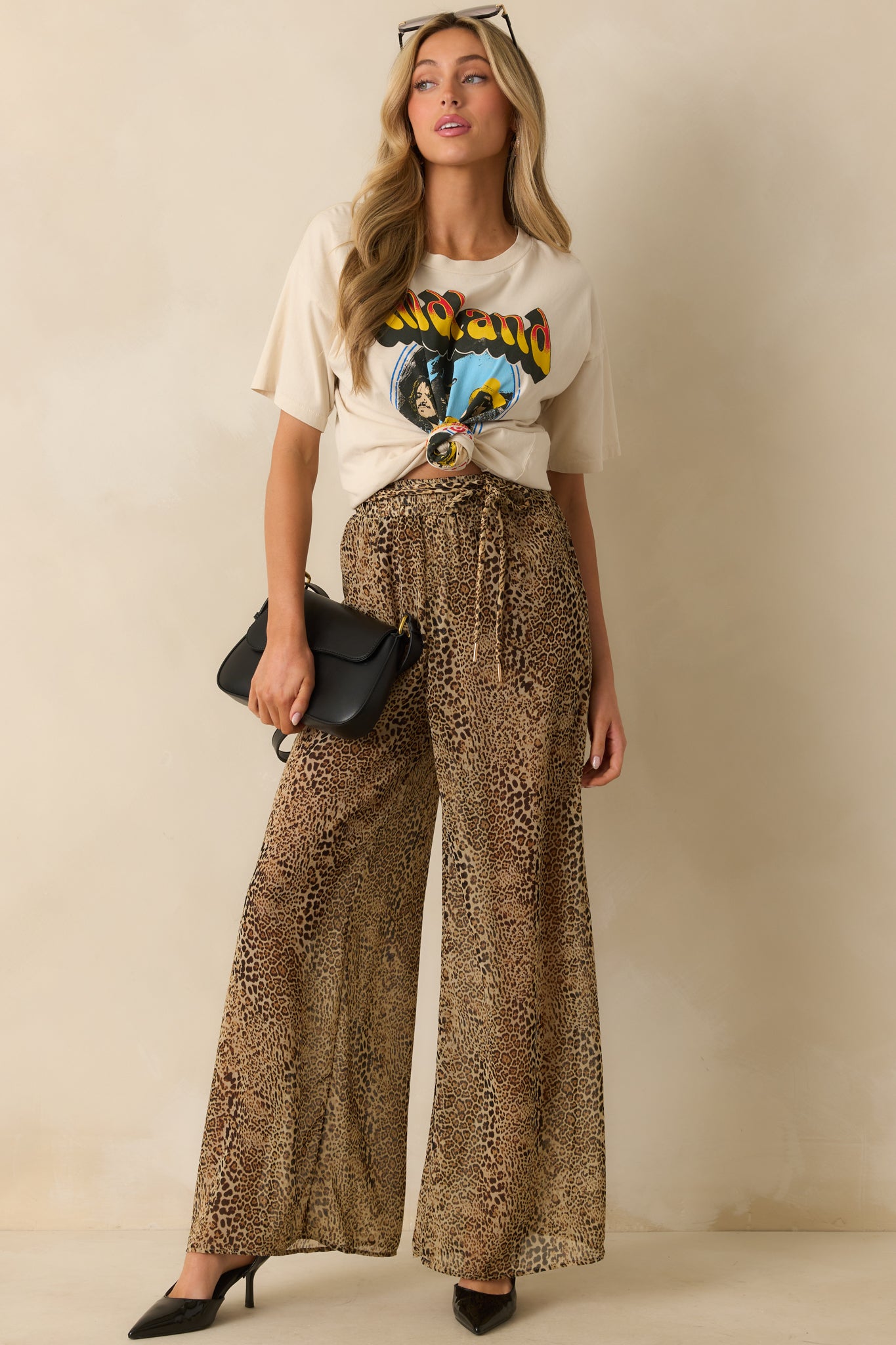 A full front view of the ivory tee featuring a Midland group portrait graphic and crew neckline.