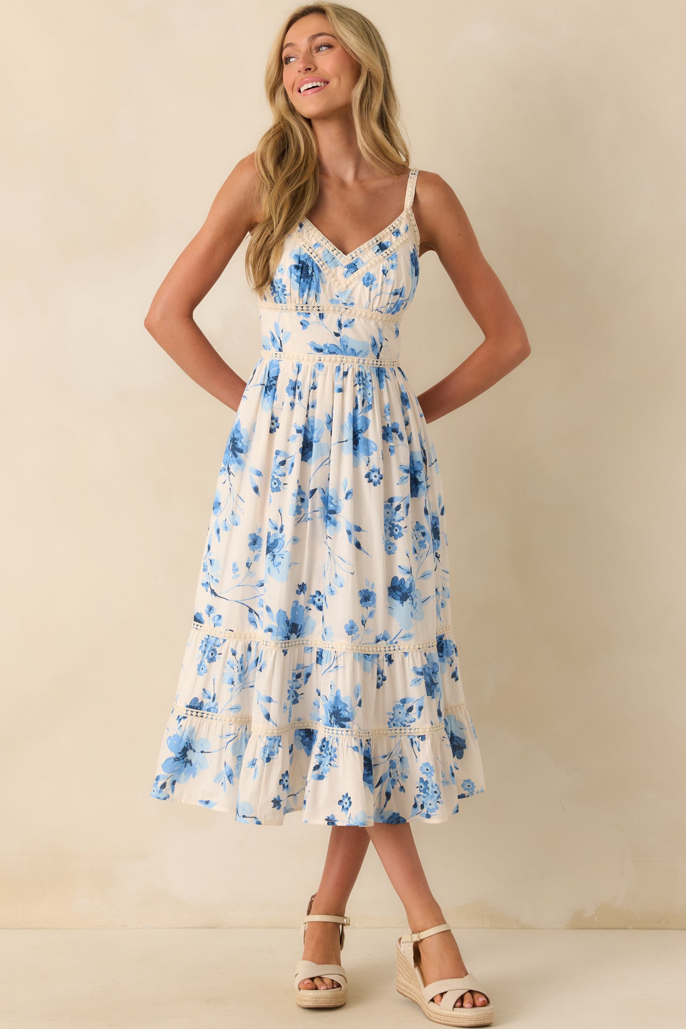 Full front view of the maxi dress showcasing the v-neckline and multi-tone blue floral print.