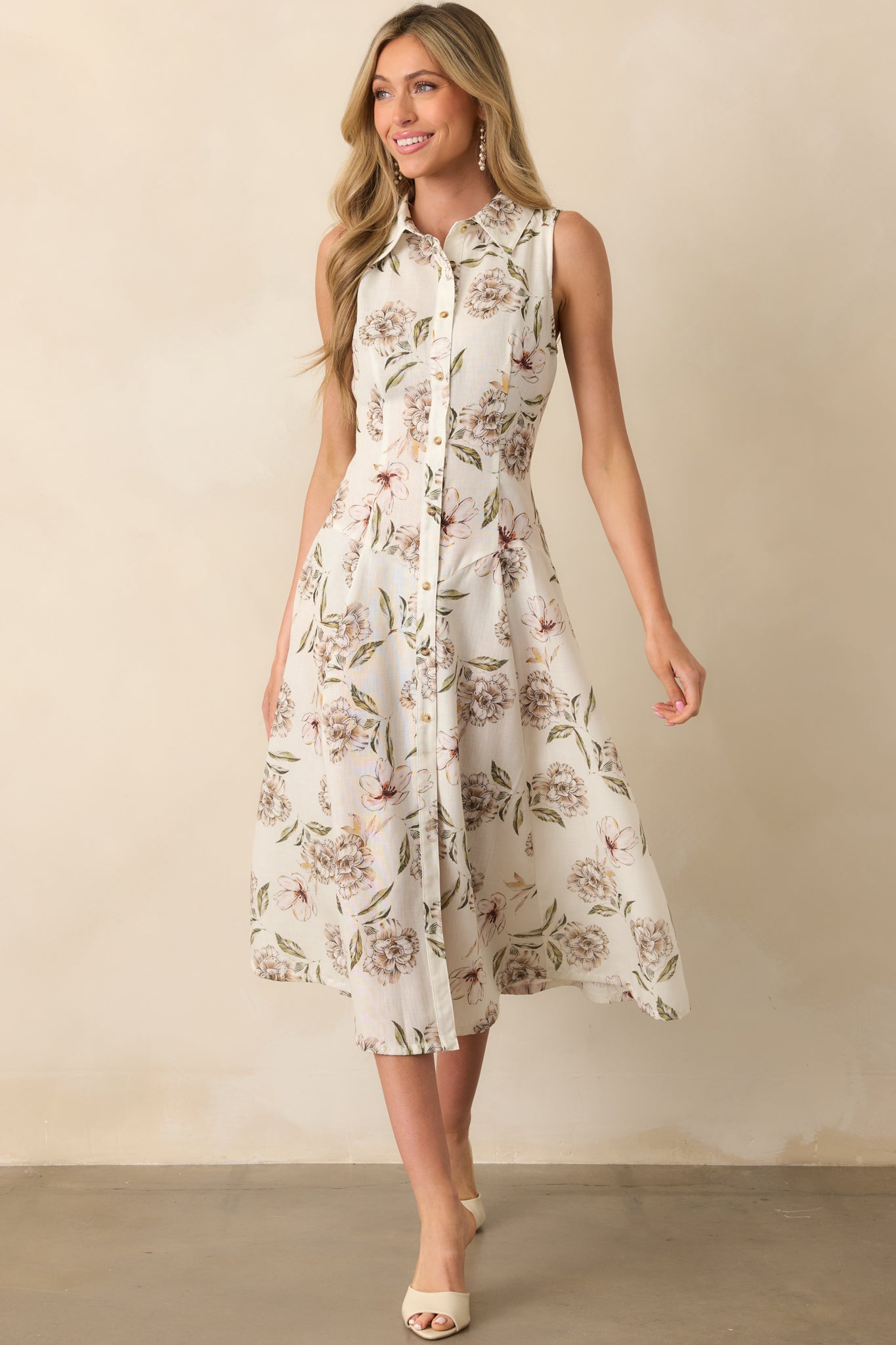 Front-facing full view of the ivory midi dress featuring a green multicolor floral print, collared neckline, and sleeveless design.
