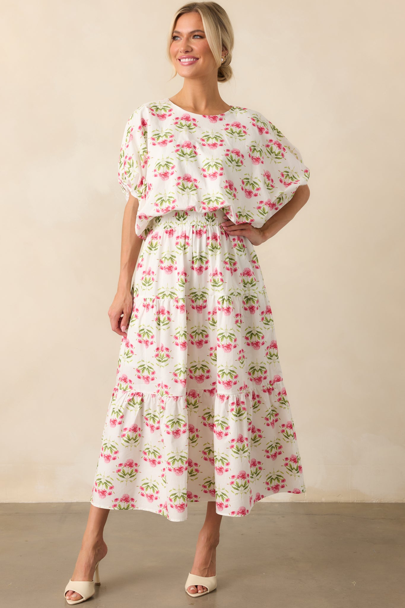 Full-length view of the pink and white maxi skirt, showcasing its relaxed fit and softly gathered tiers.