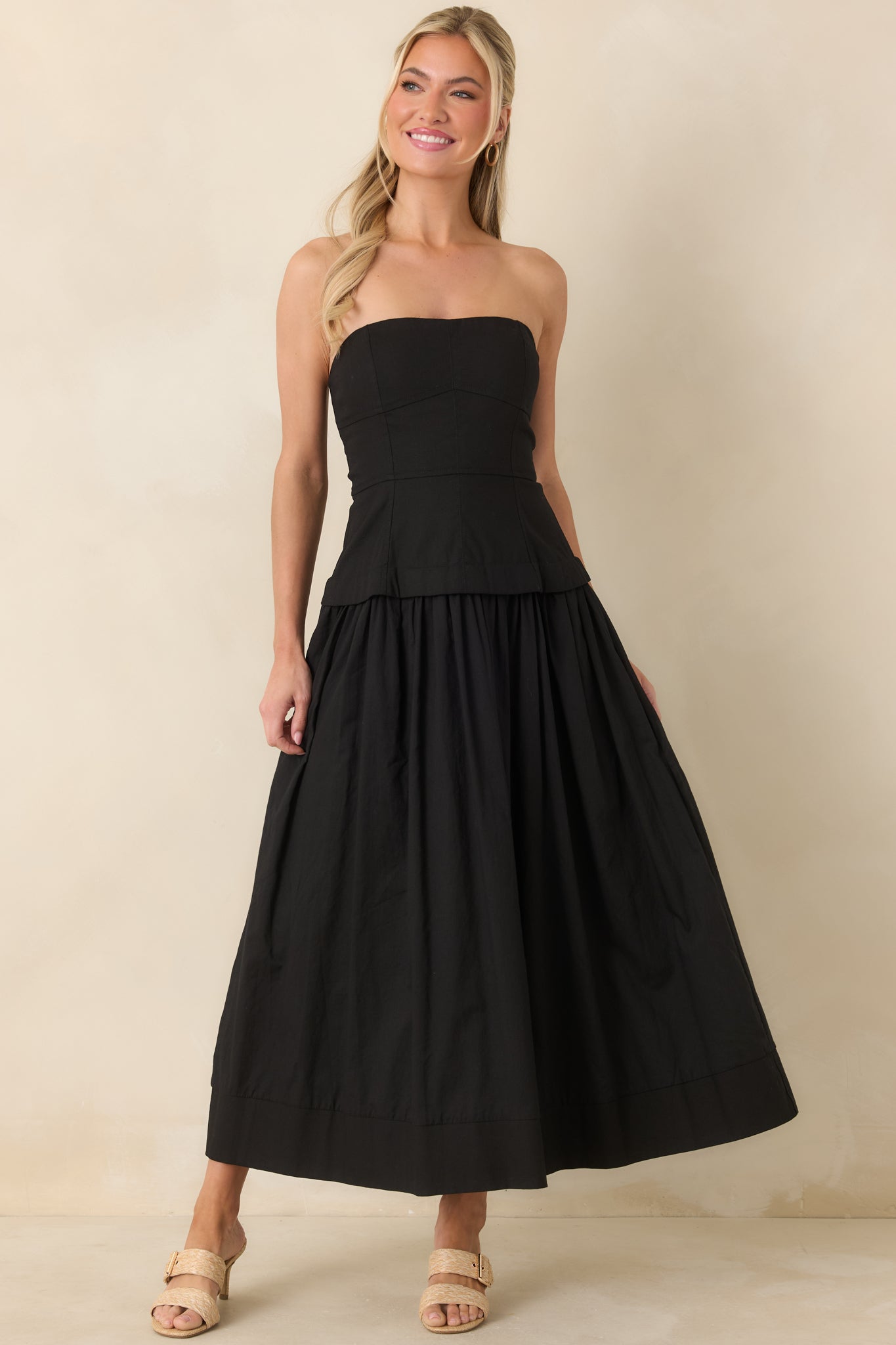 Full view showcasing the fitted bodice and relaxed skirt with hidden pockets for added functionality.
