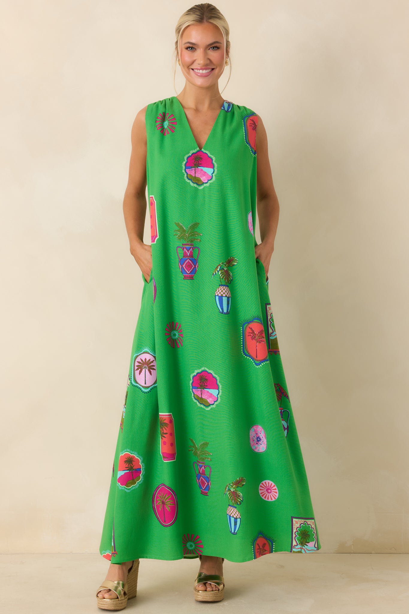 Full front view showcasing the sleeveless cut, loose fit, and allover tropical postcard-inspired print.