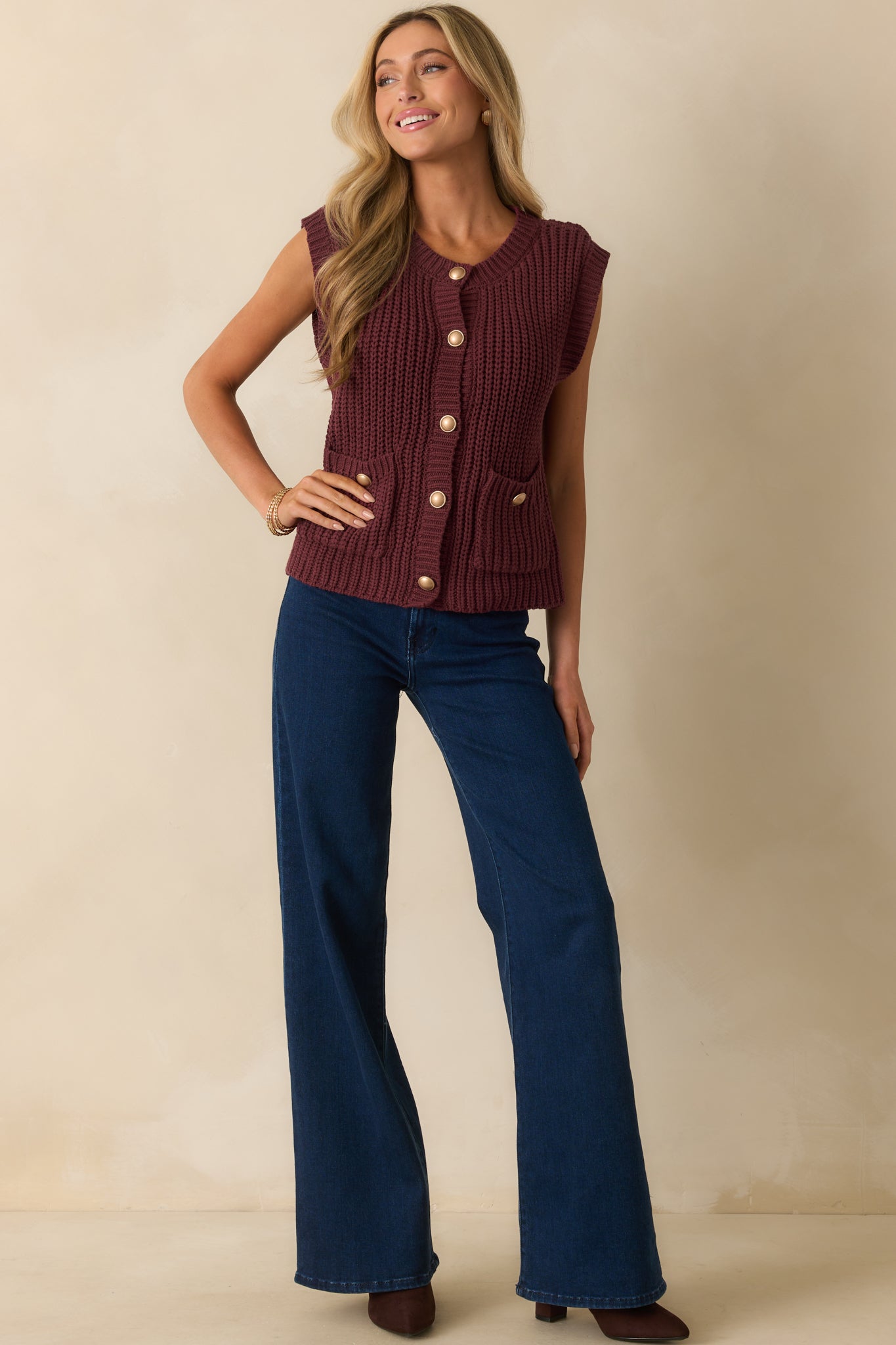 Functional patch pocket wine red vest featuring a round neckline and longline silhouette.