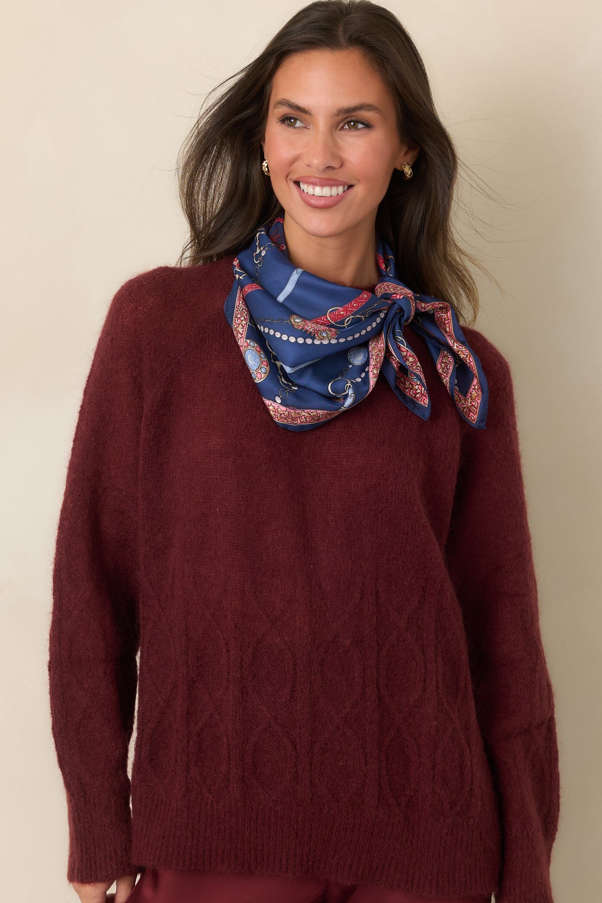 Fuzzy semi-sheer top displaying the dimensional cable pattern and softly ribbed neckline.