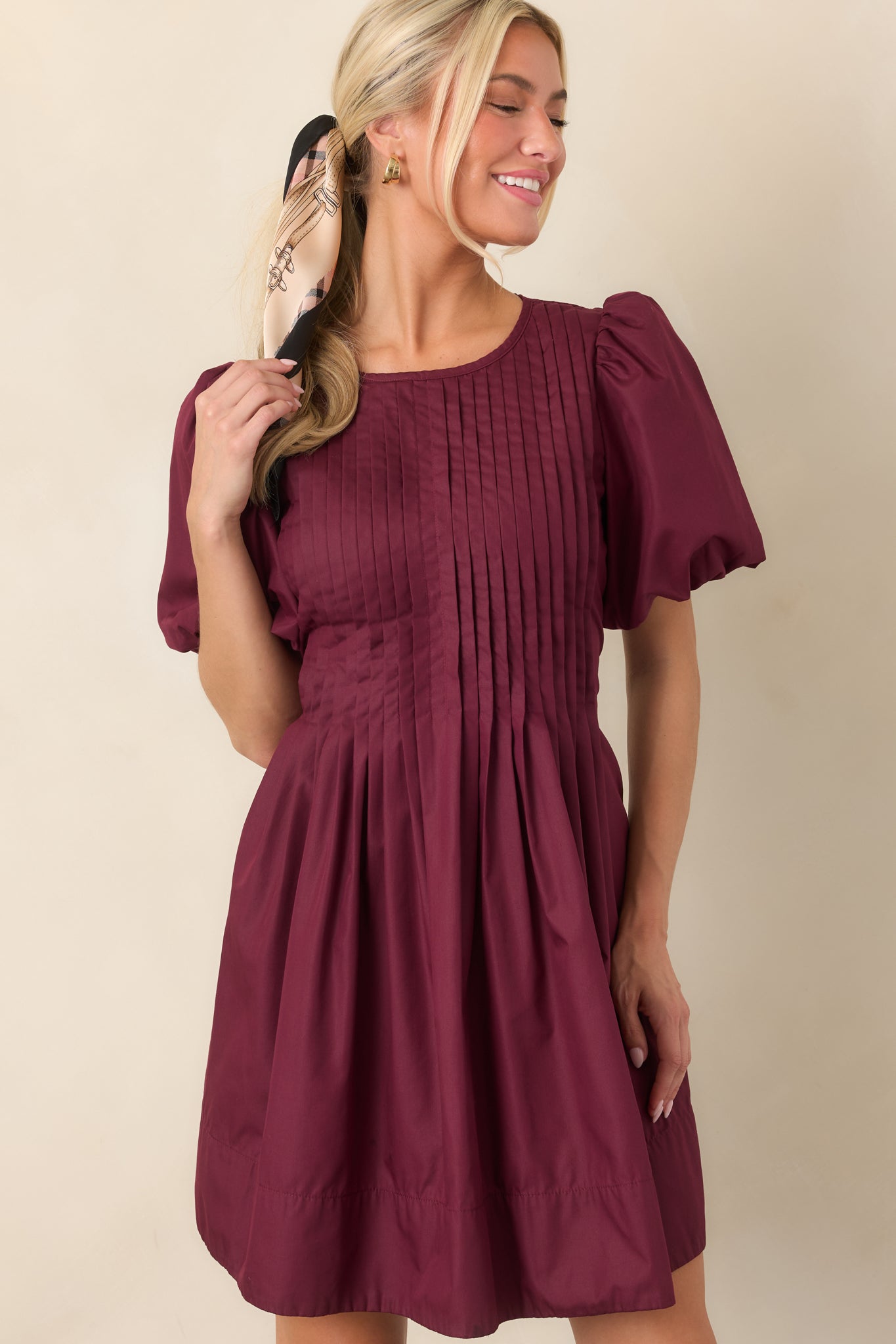 Mini dress detail featuring the full gathered skirt and subtle side pocket opening integrated into the flowing silhouette.