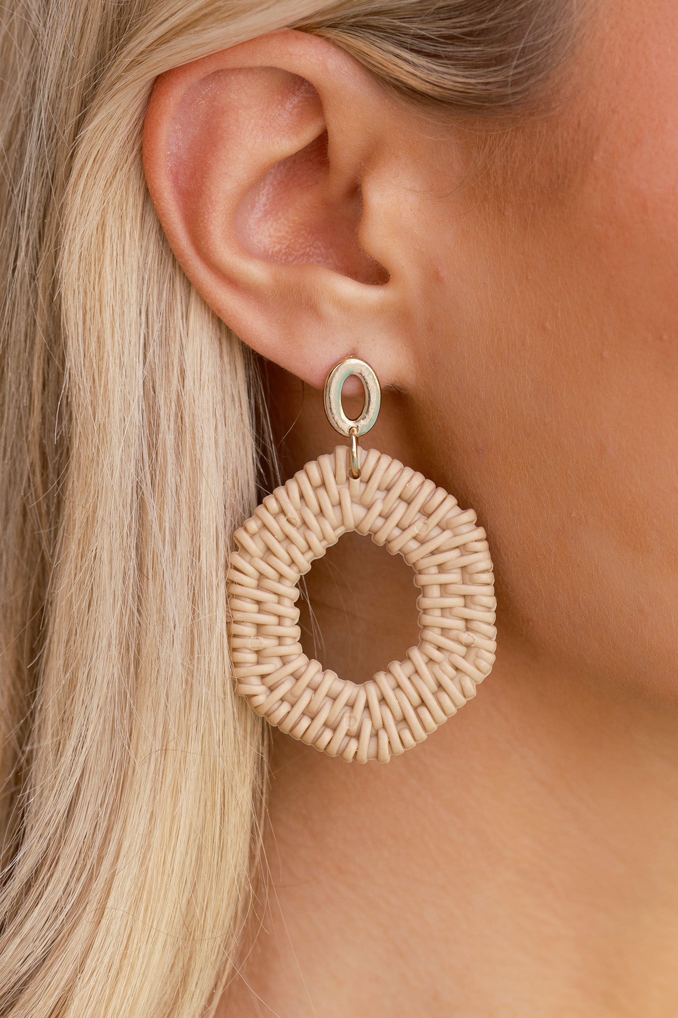 Modern gold oval studs linked to airy hexagon raffia-style drops.