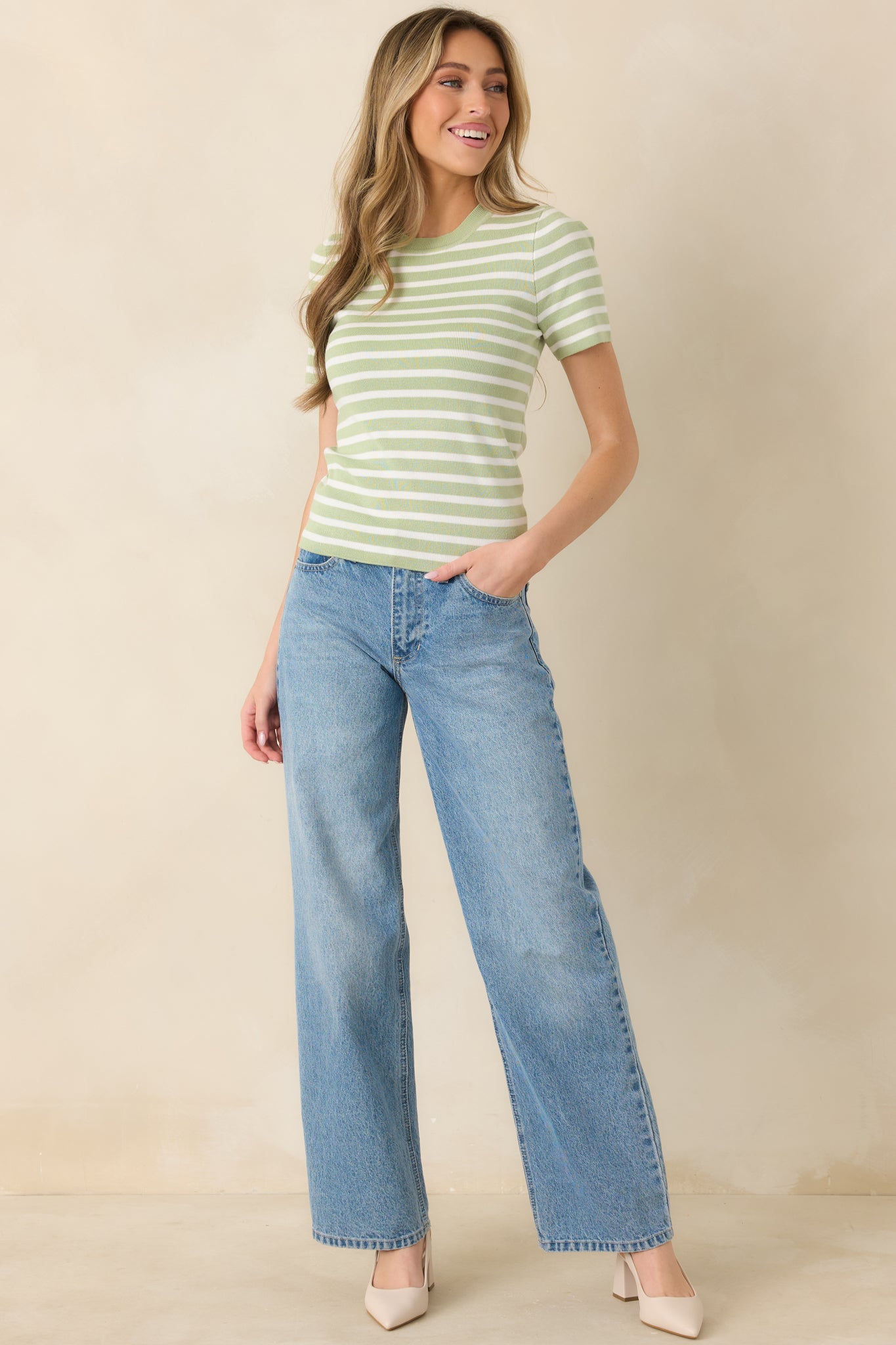 Green and ivory stripe knit top with short sleeves, showcasing a smooth, body-skimming fit and clean neckline.