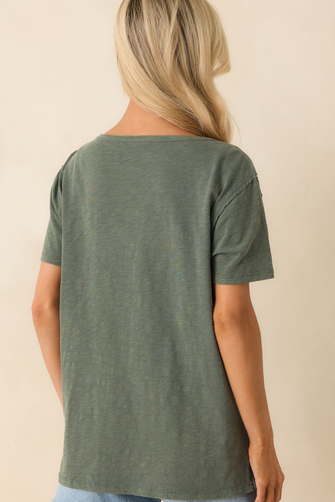 A back view of the tee showing the straight hem, short sleeves, and relaxed overall fit.