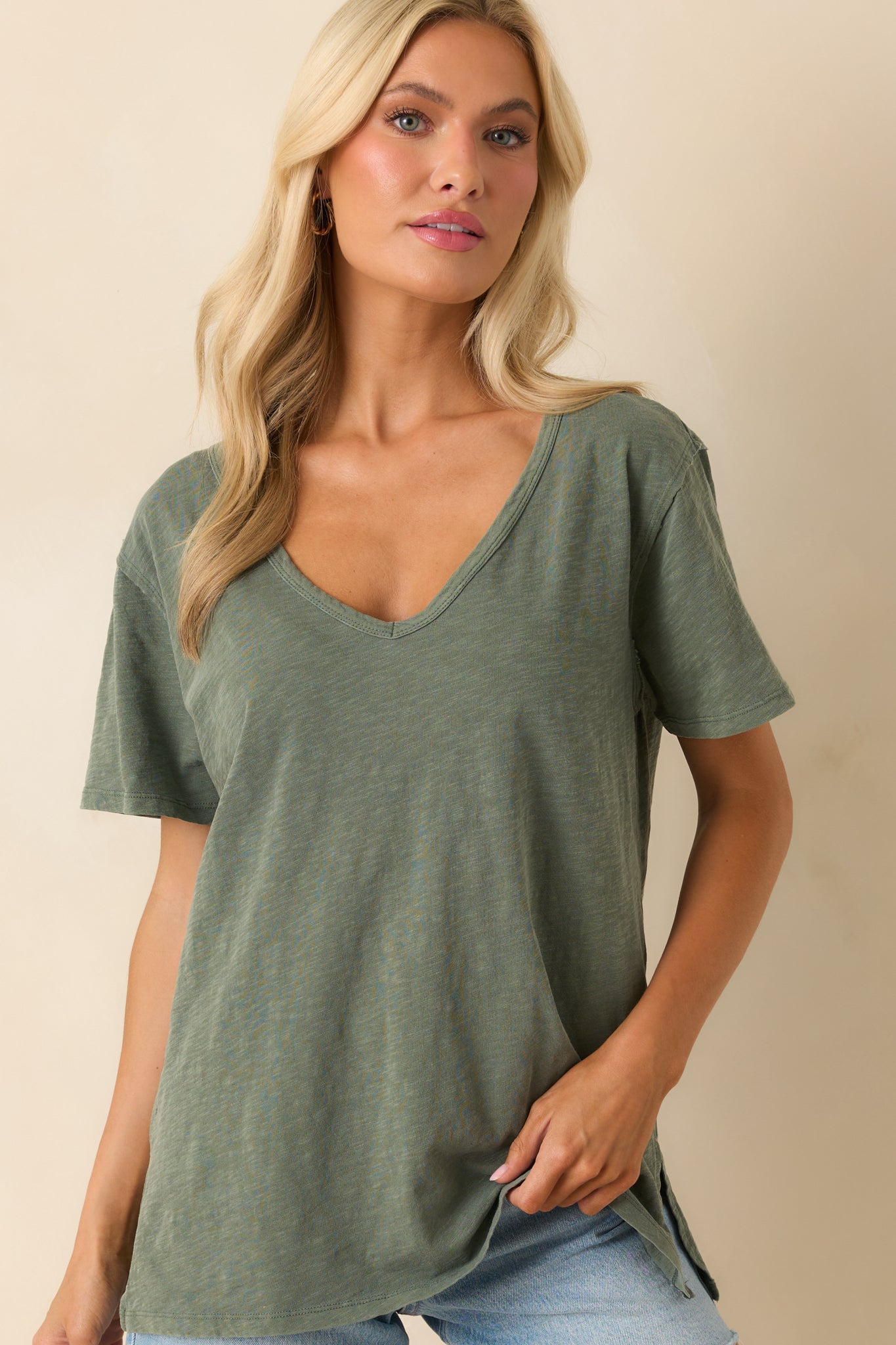 A cropped image focusing on the v-neckline and soft texture of the cotton fabric.