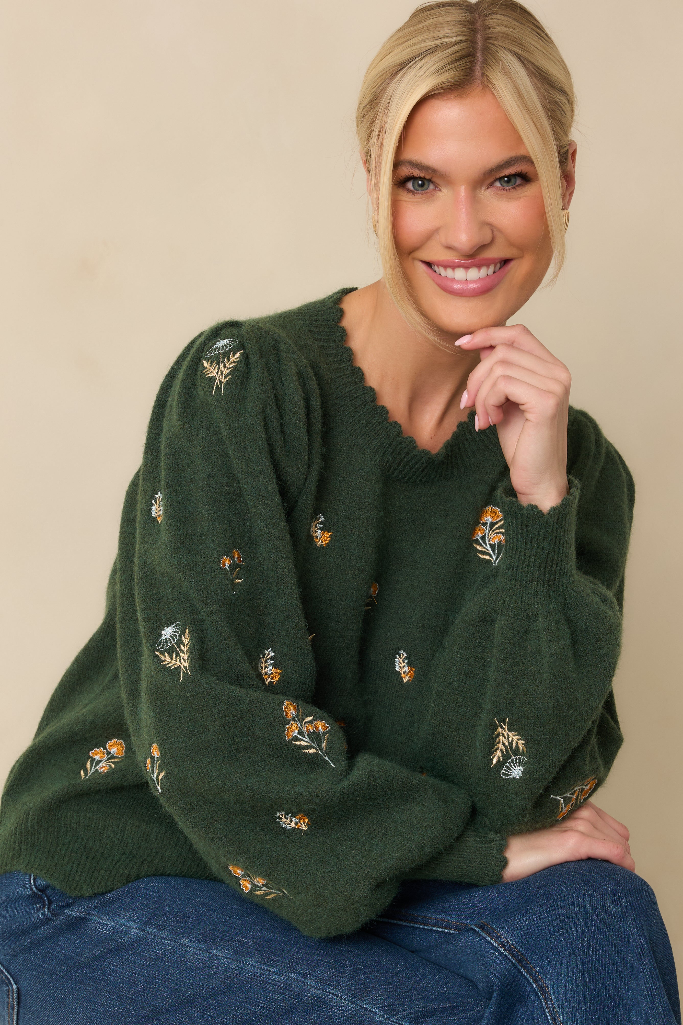 Green floral knit sweater featuring a scalloped crew neckline and balloon sleeves.
