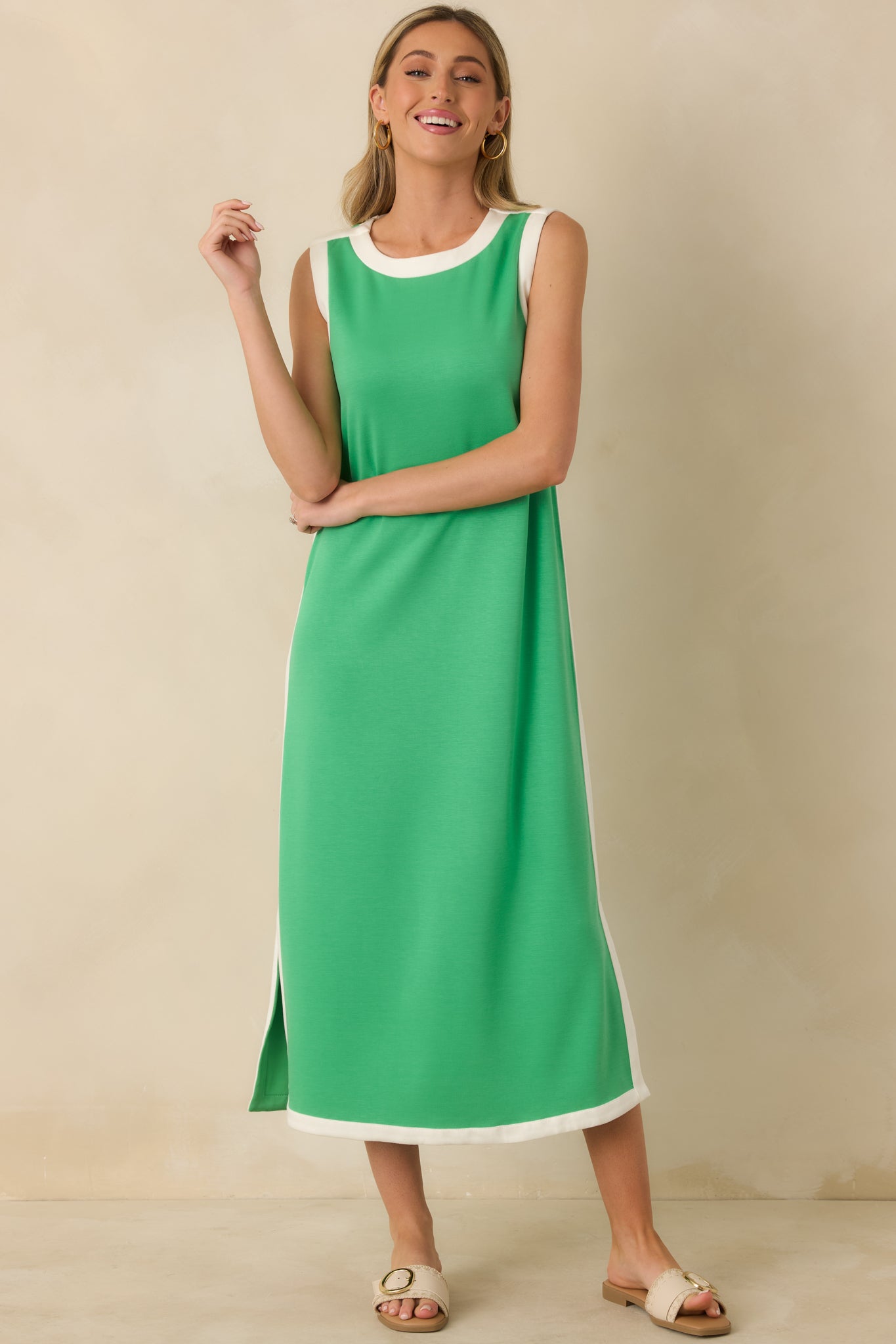 Green sleeveless maxi dress highlighting the straight fit and midi-to-maxi length proportions.