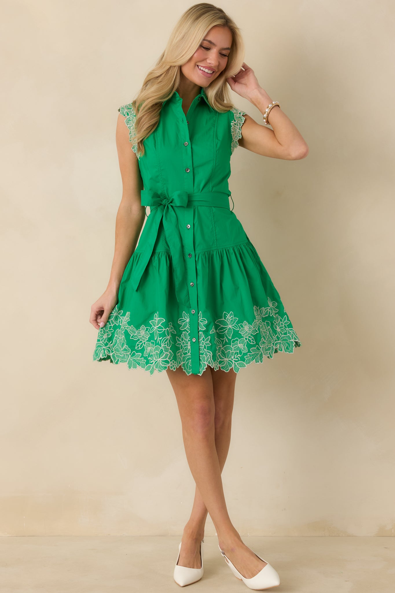 Green mini dress with a classic button-down front, cap sleeves, pointed collar, and removable self-tie belt.