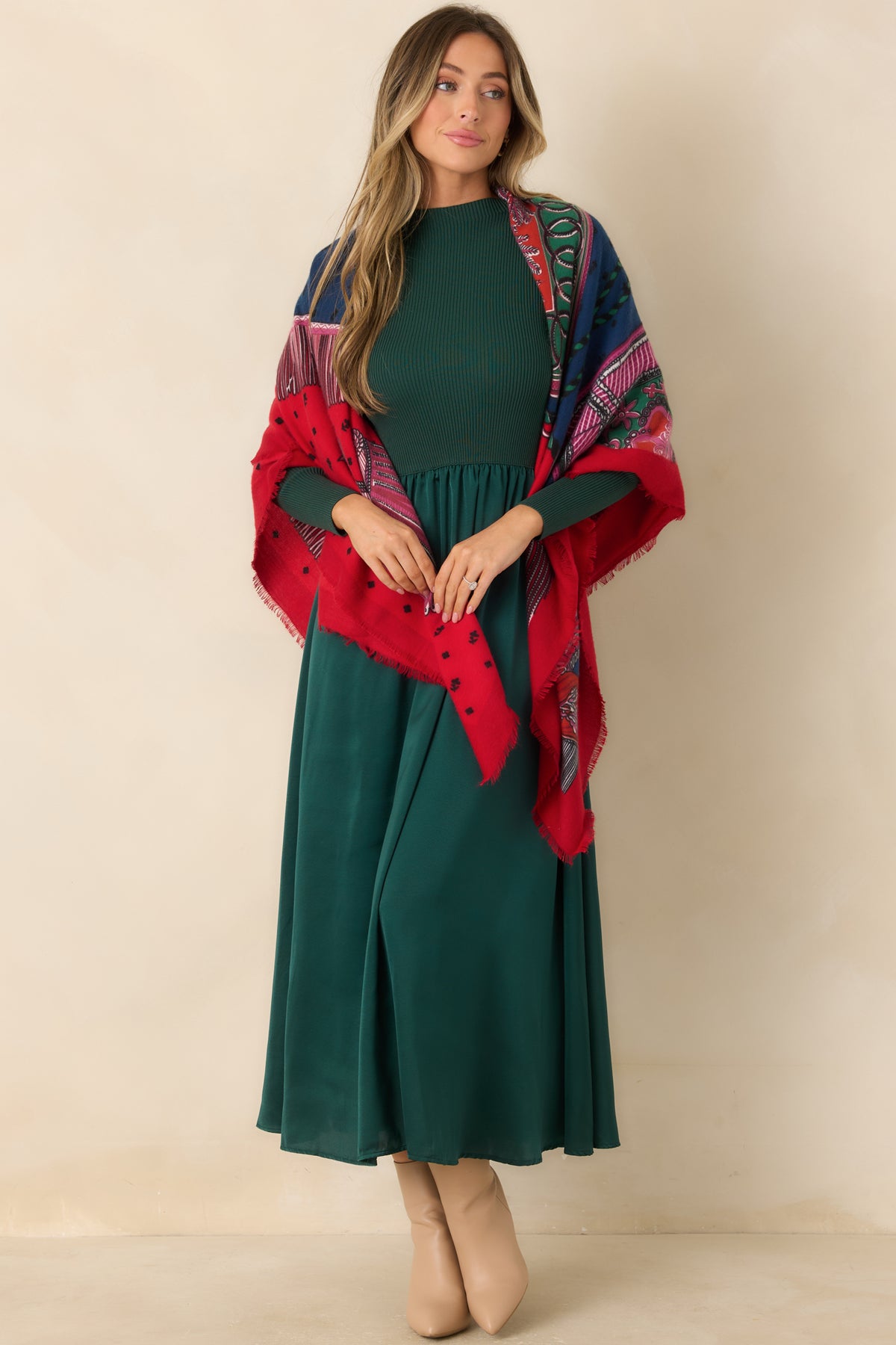 Fitted ribbed green bodice transitions into a flowing satin skirt with a gently flared silhouette.