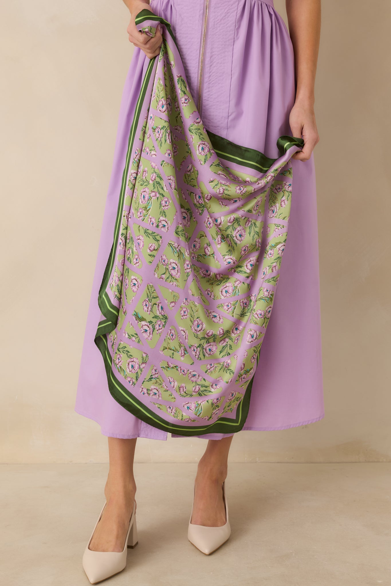 Complete image of the square scarf highlighting the soft green background layered with a lavender geometric lattice and contrast striping along the border.