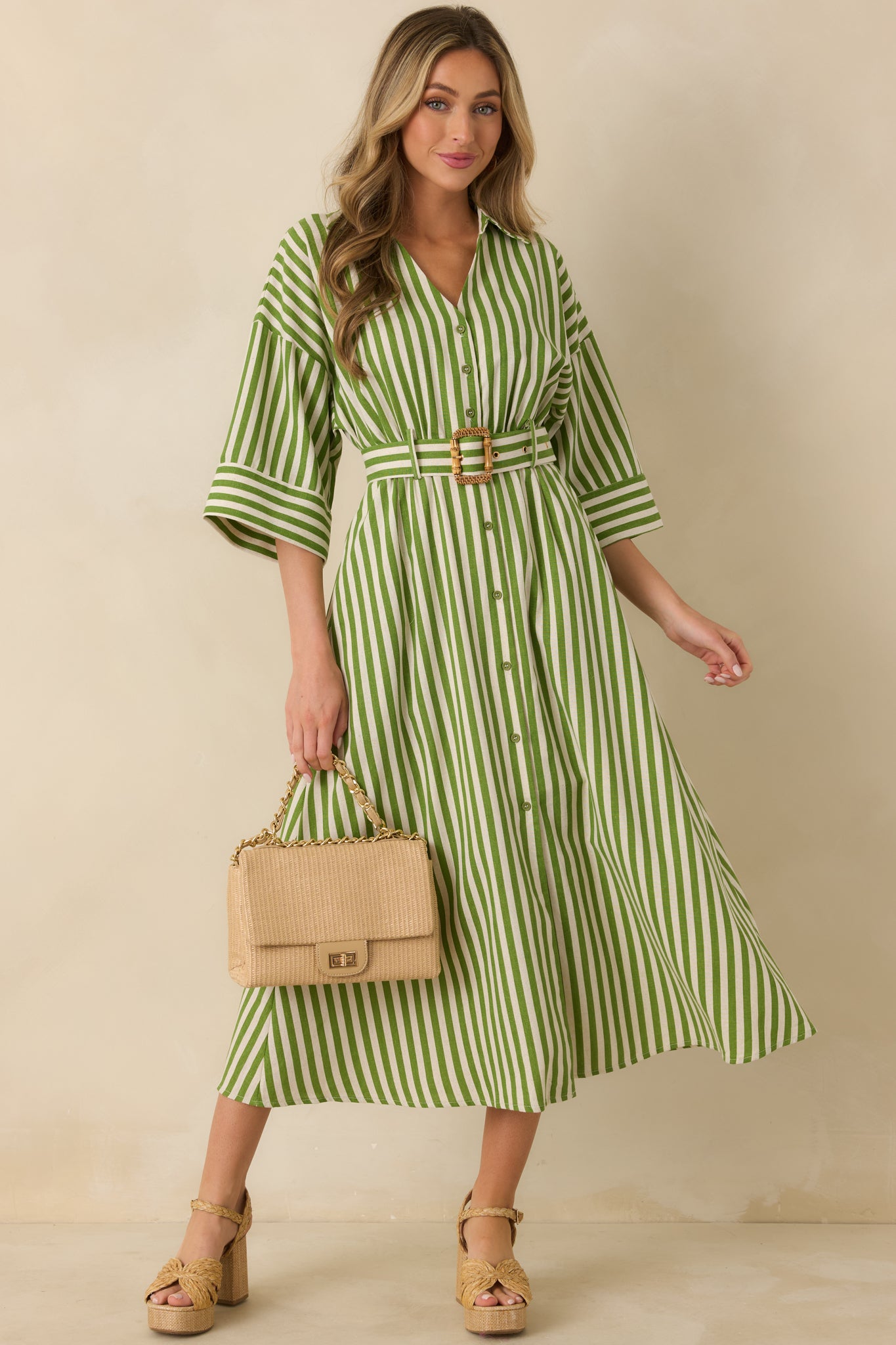 Green striped woven shirt dress highlighting a clean button-front closure and relaxed, everyday silhouette