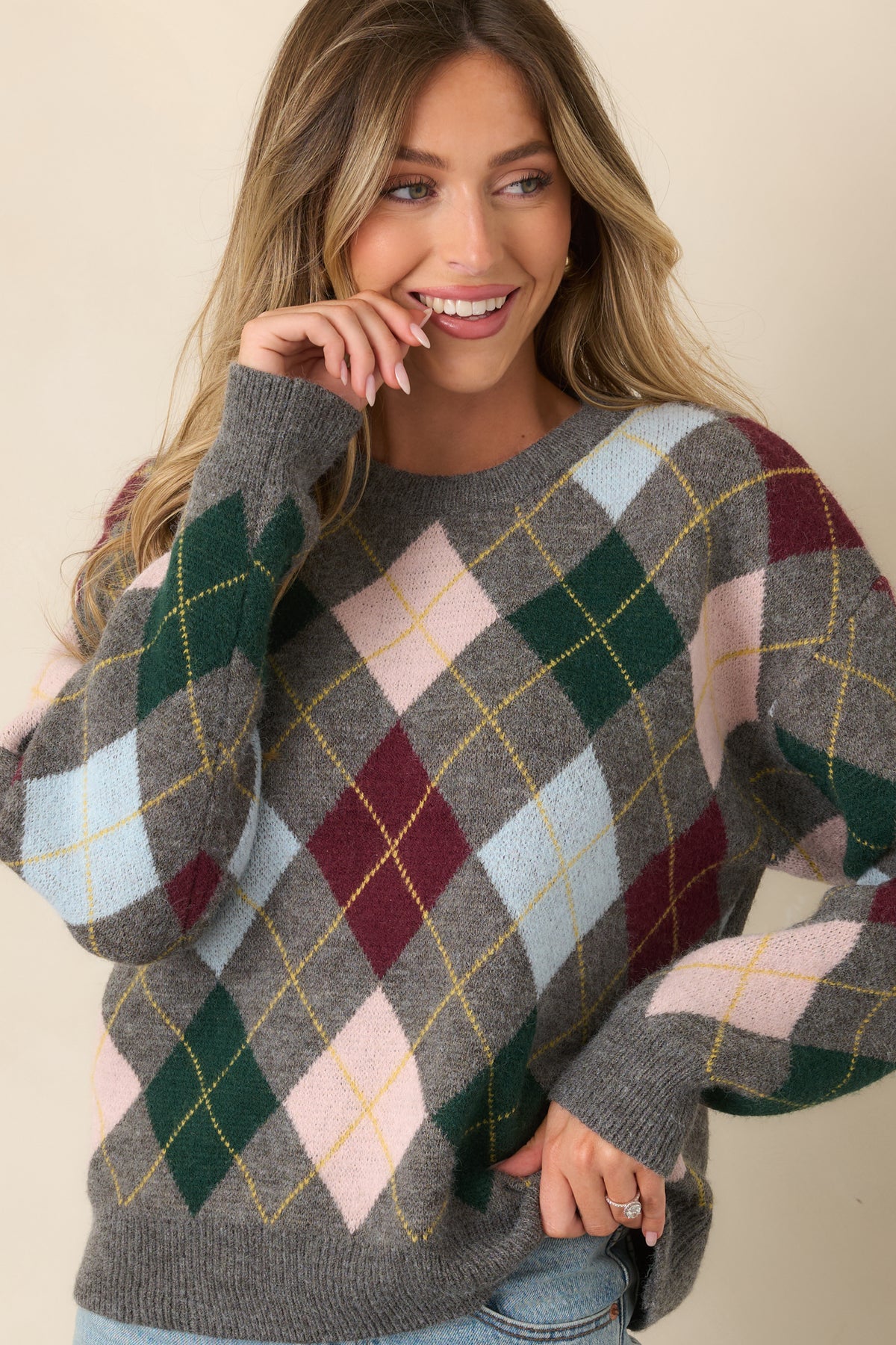 Grey argyle sweater featuring long sleeves and dropped shoulders for a relaxed shape.