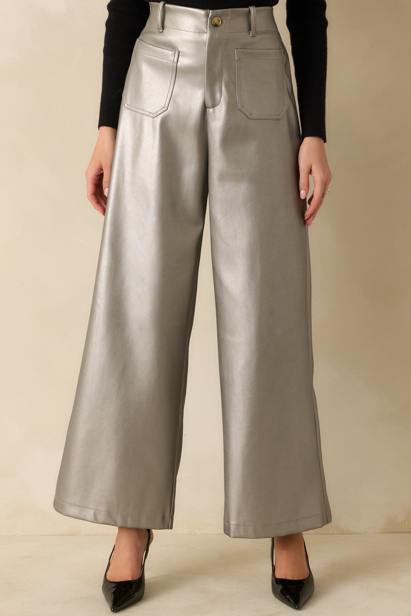Grey metallic fabric gleaming across the wide leg fit with subtle texture and movement.