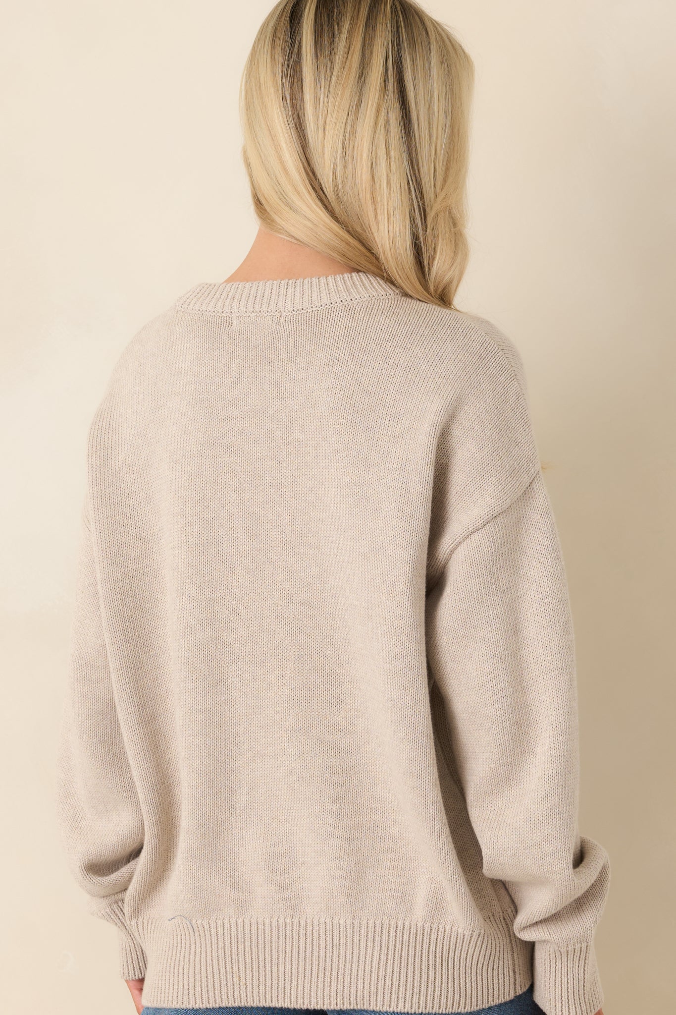 Rear view of natural heather boyfriend sweater featuring clean knit design, long sleeves, and ribbed trim at neckline, cuffs, and hem.