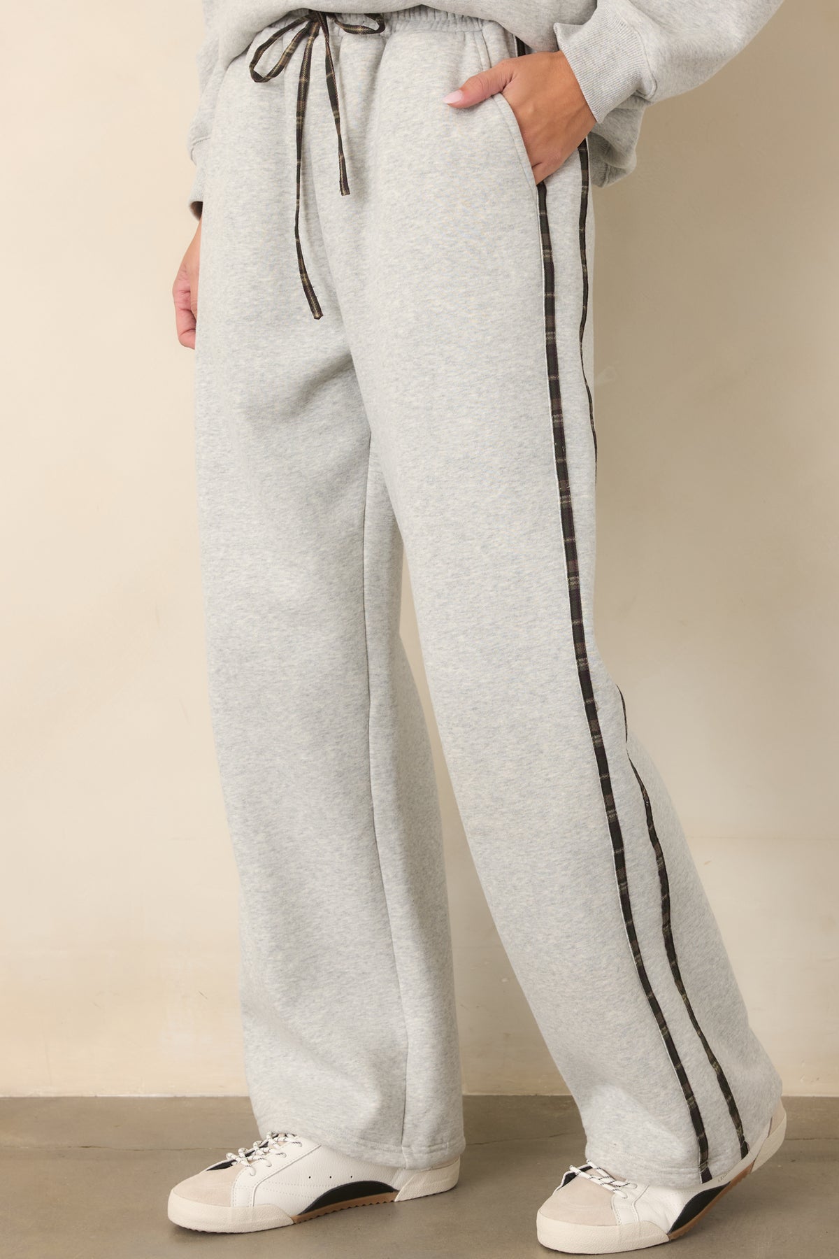 Straight-leg heather grey sweatpants with subtle plaid stripes adding texture to the casual design.