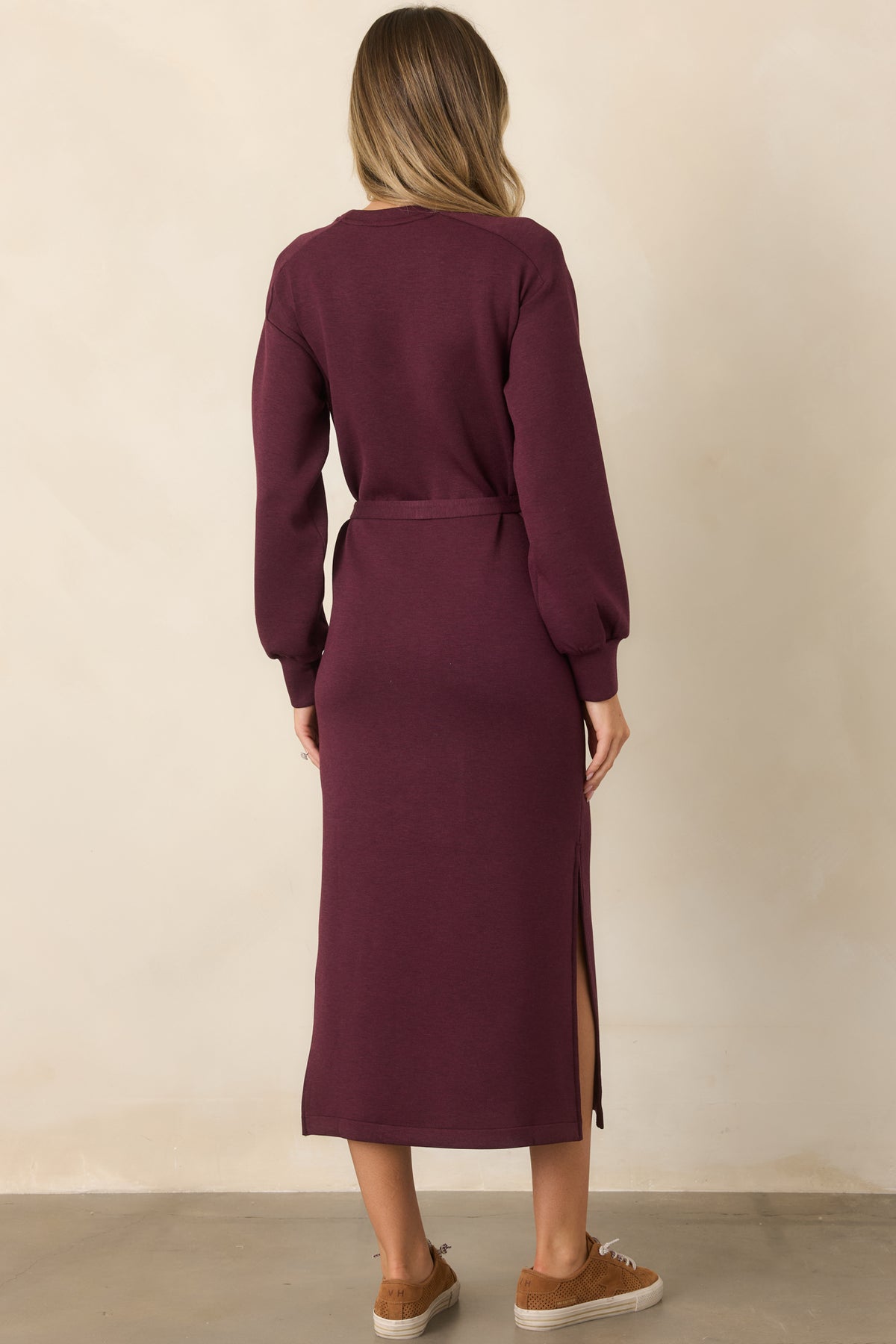 Rear of the heathered burgundy midi dress with a relaxed silhouette, long sleeves, and straight skirt.
