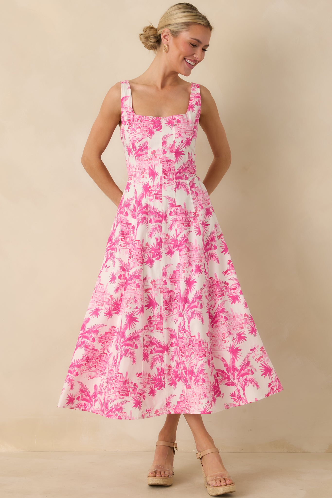 Front view of a hibiscus pink midi dress with square neckline, wide shoulder straps, and fitted bodice with princess seams.