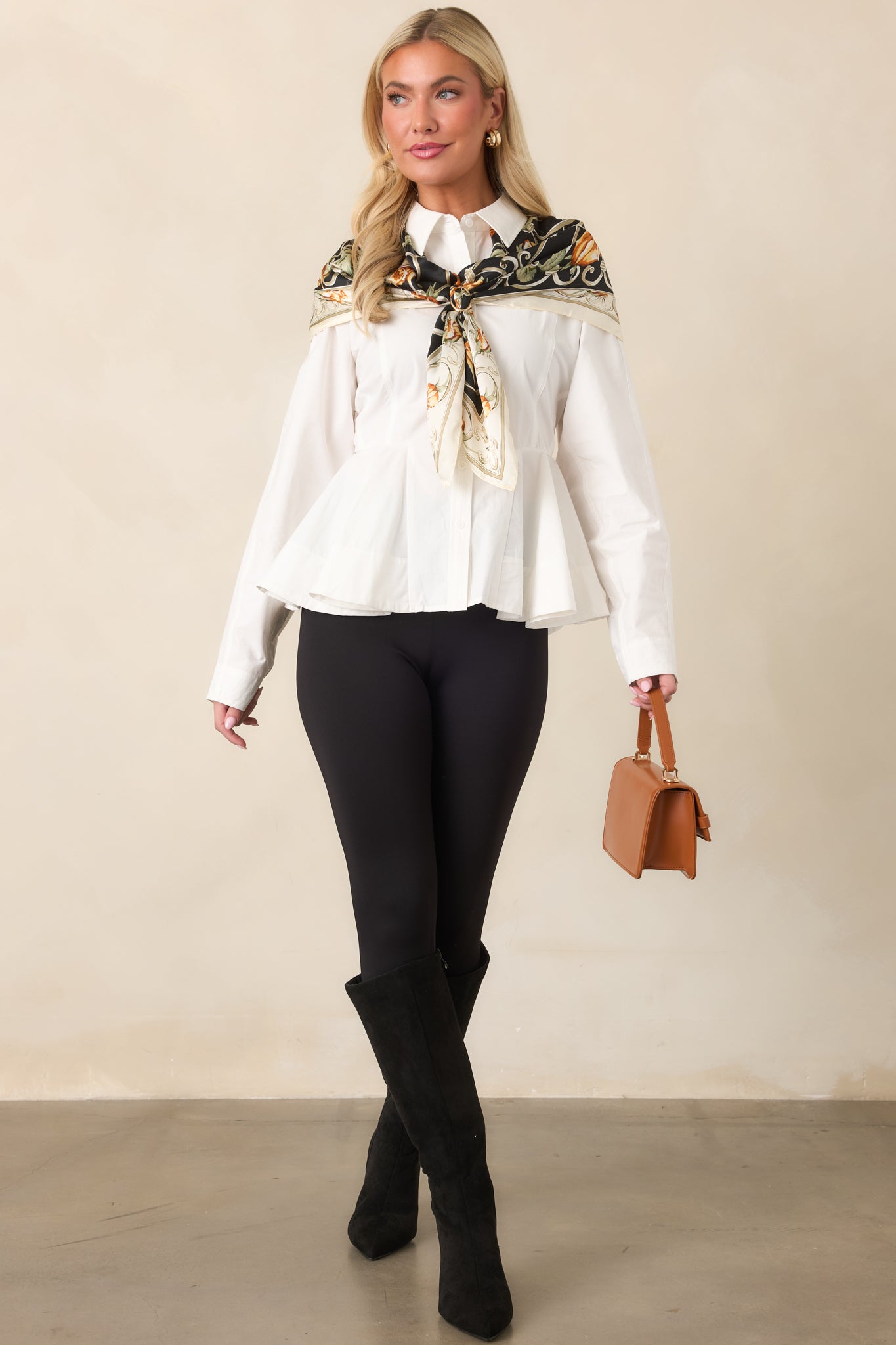 High-rise pants with a smooth, body-skimming fit and streamlined stirrup foot straps for an elongated silhouette.