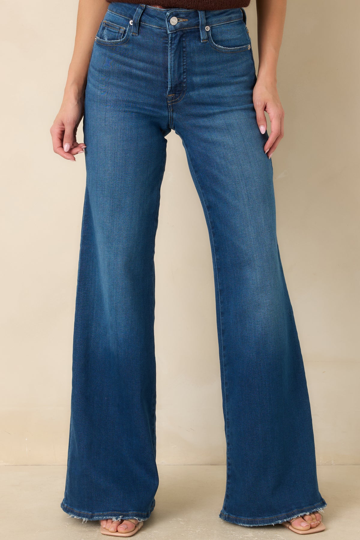 High-rise denim waistband with reinforced belt loops and a smooth, fitted front.