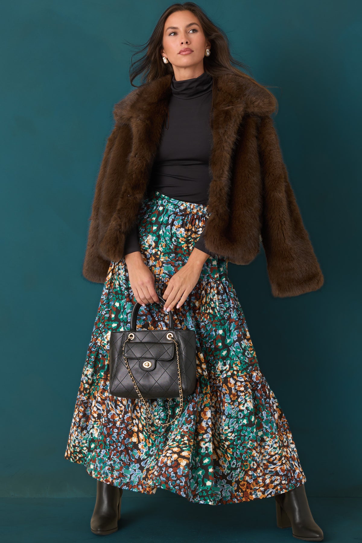 High-rise skirt featuring a fitted waistband and flowing tiered silhouette with generous volume.