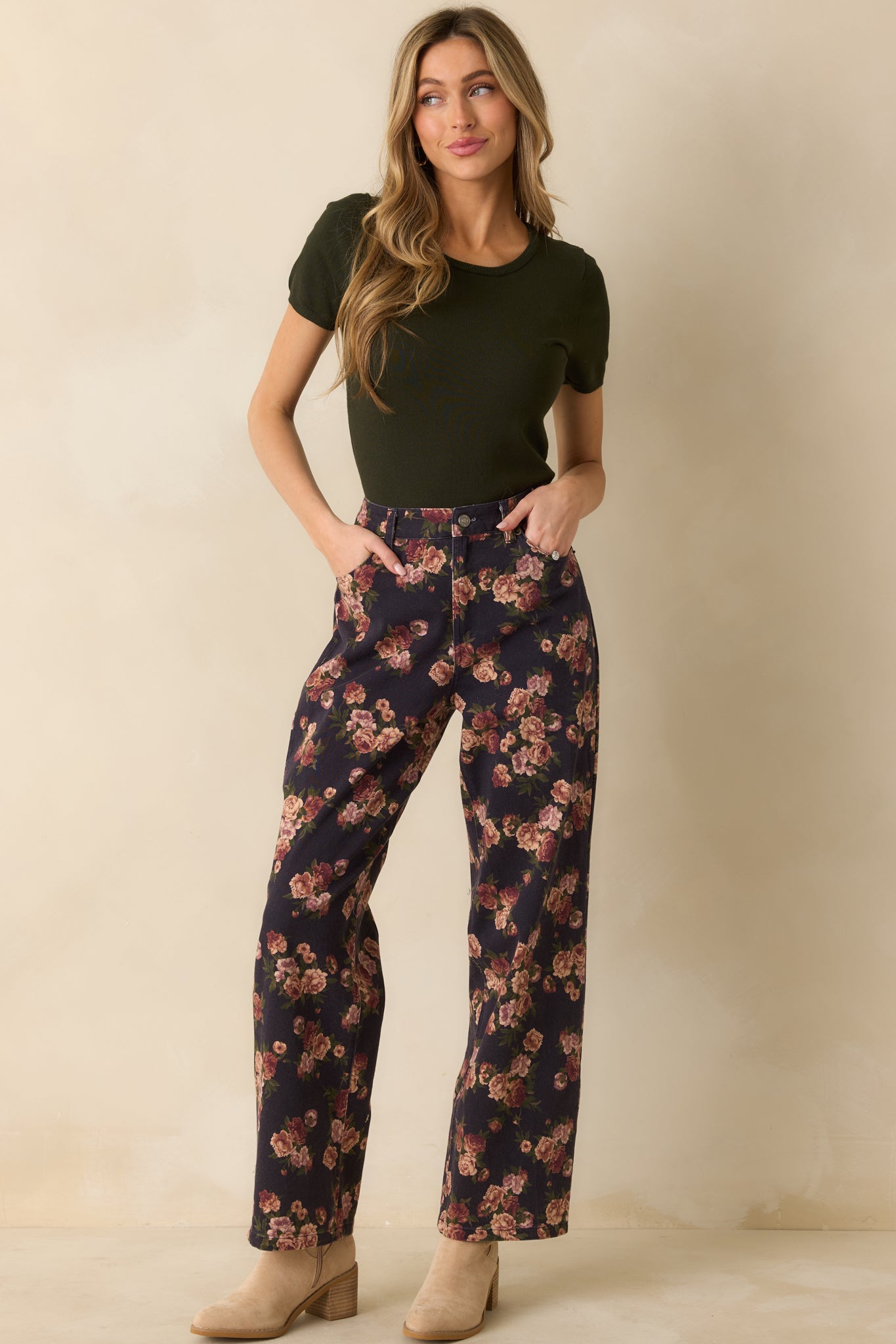 High-rise navy jeans with small floral motifs, straight-leg silhouette, and comfortable fit across the hips and thighs.
