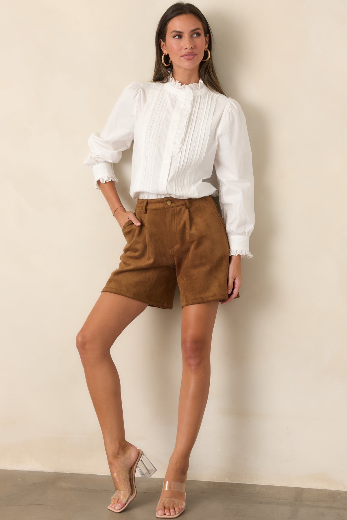 High-rise shorts showcasing a polished waistband and easy relaxed-leg silhouette.