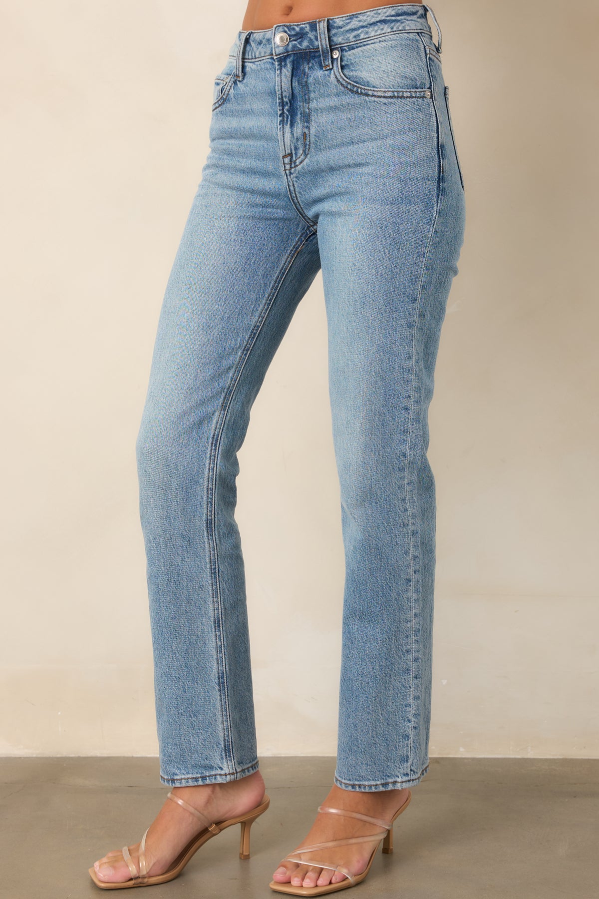 High-rise straight-leg jeans with a timeless fit and lightly faded denim finish.