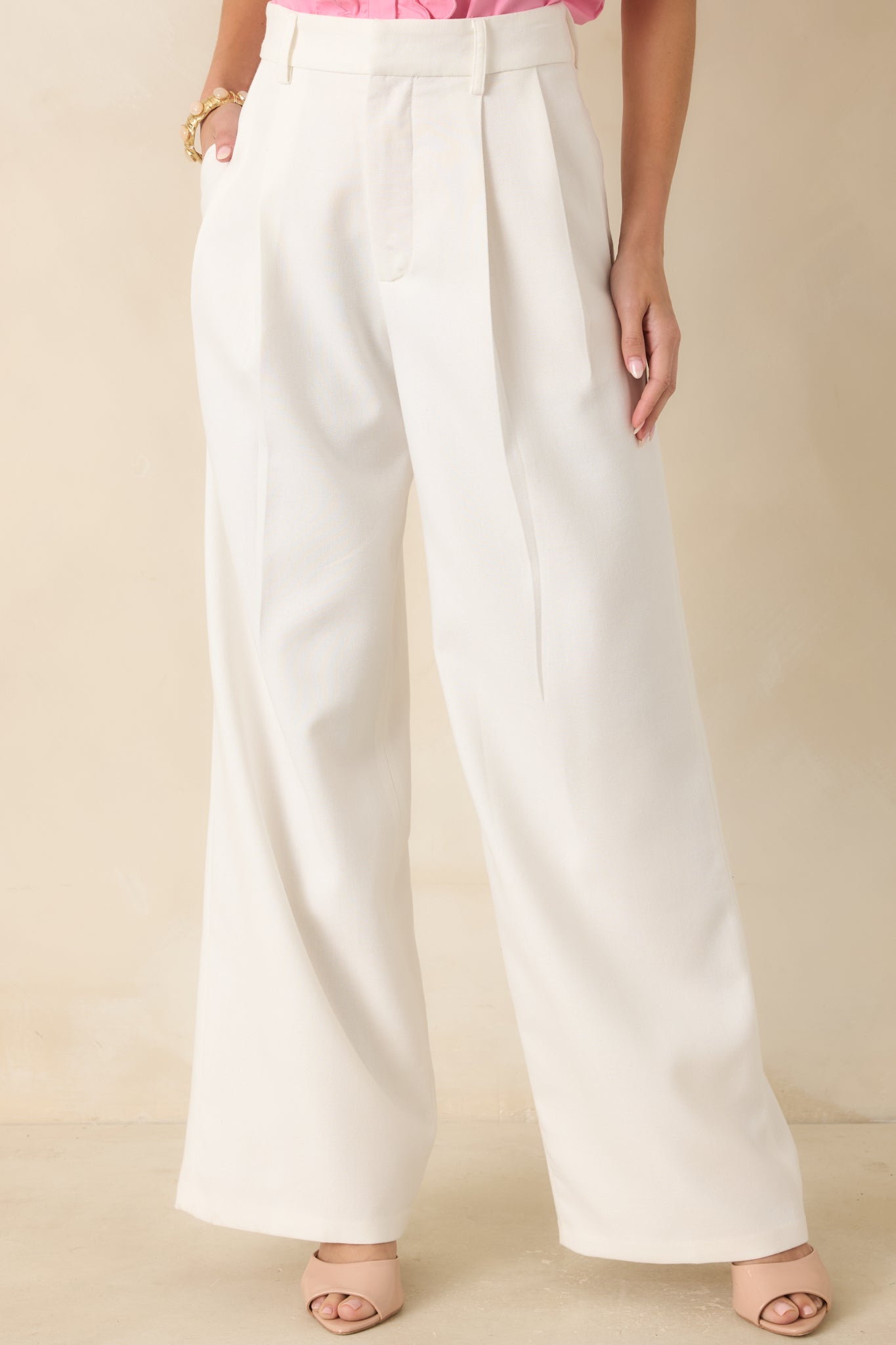 Close view of the high-rise waistband highlighting the zipper fly and hook-and-bar closure.