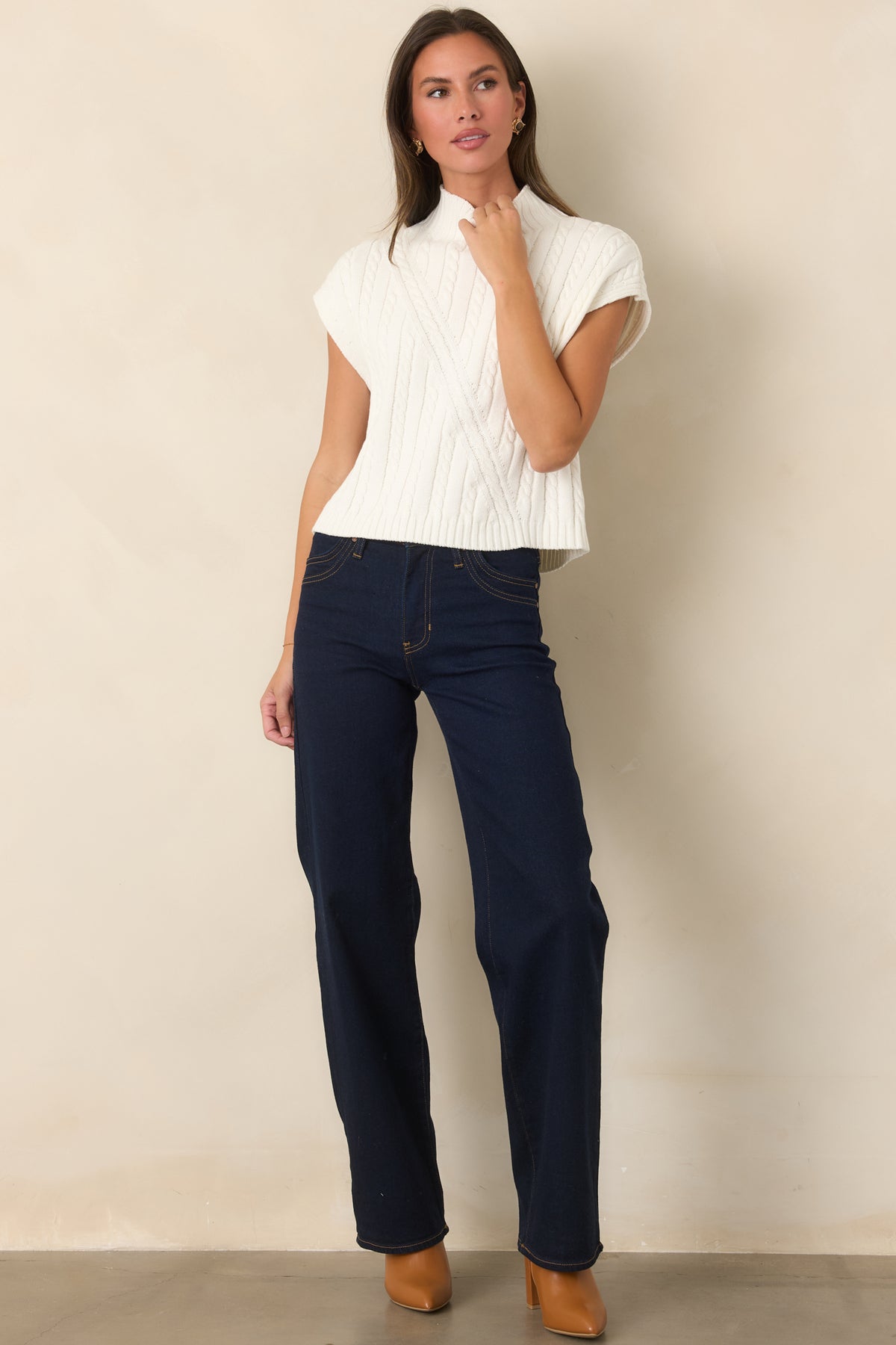 High-rise wide-leg jeans showcasing the clean deep indigo wash and modern silhouette.