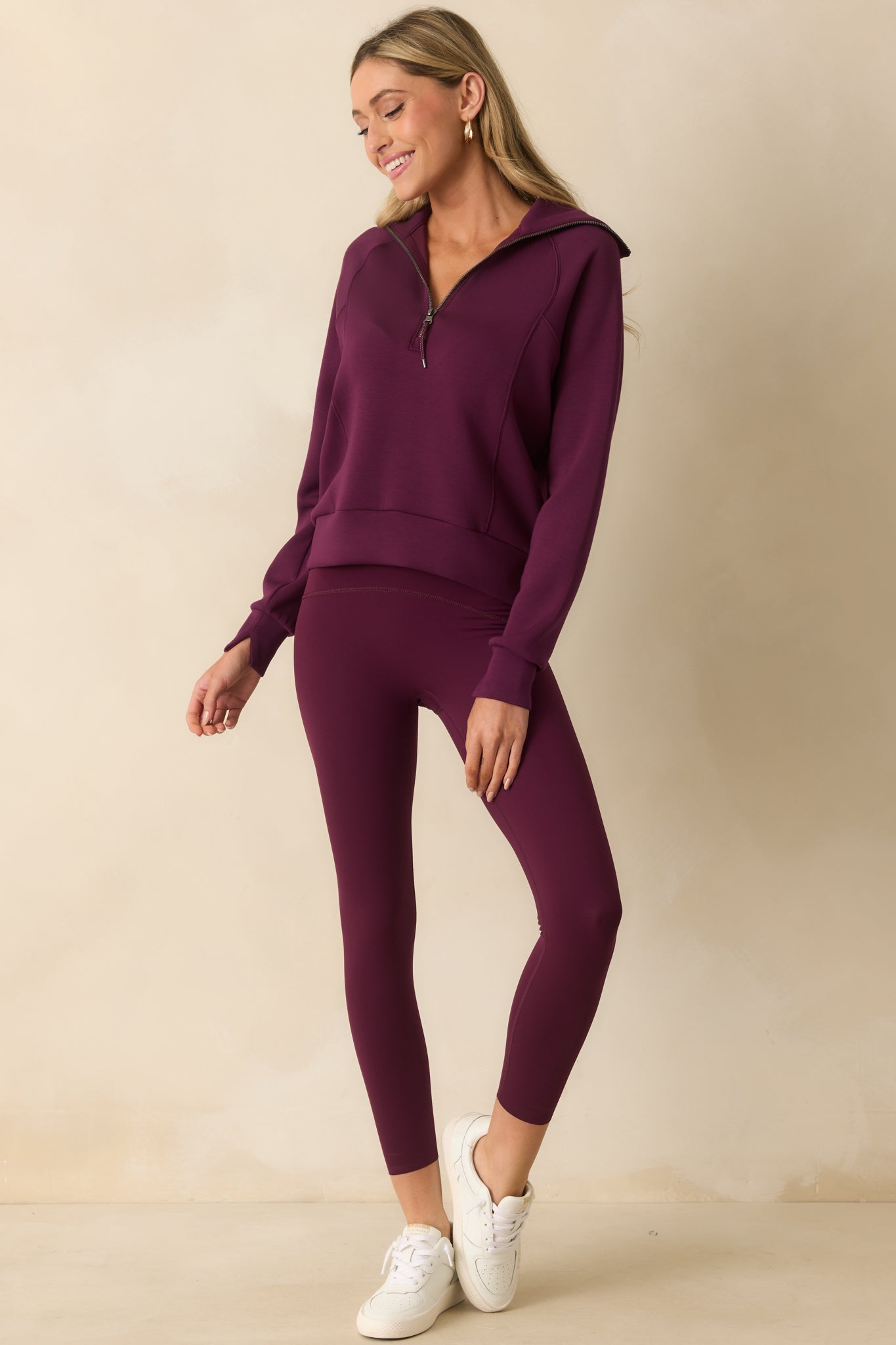High-waisted berry leggings displayed fully front-facing, emphasizing the fitted shape and streamlined look.