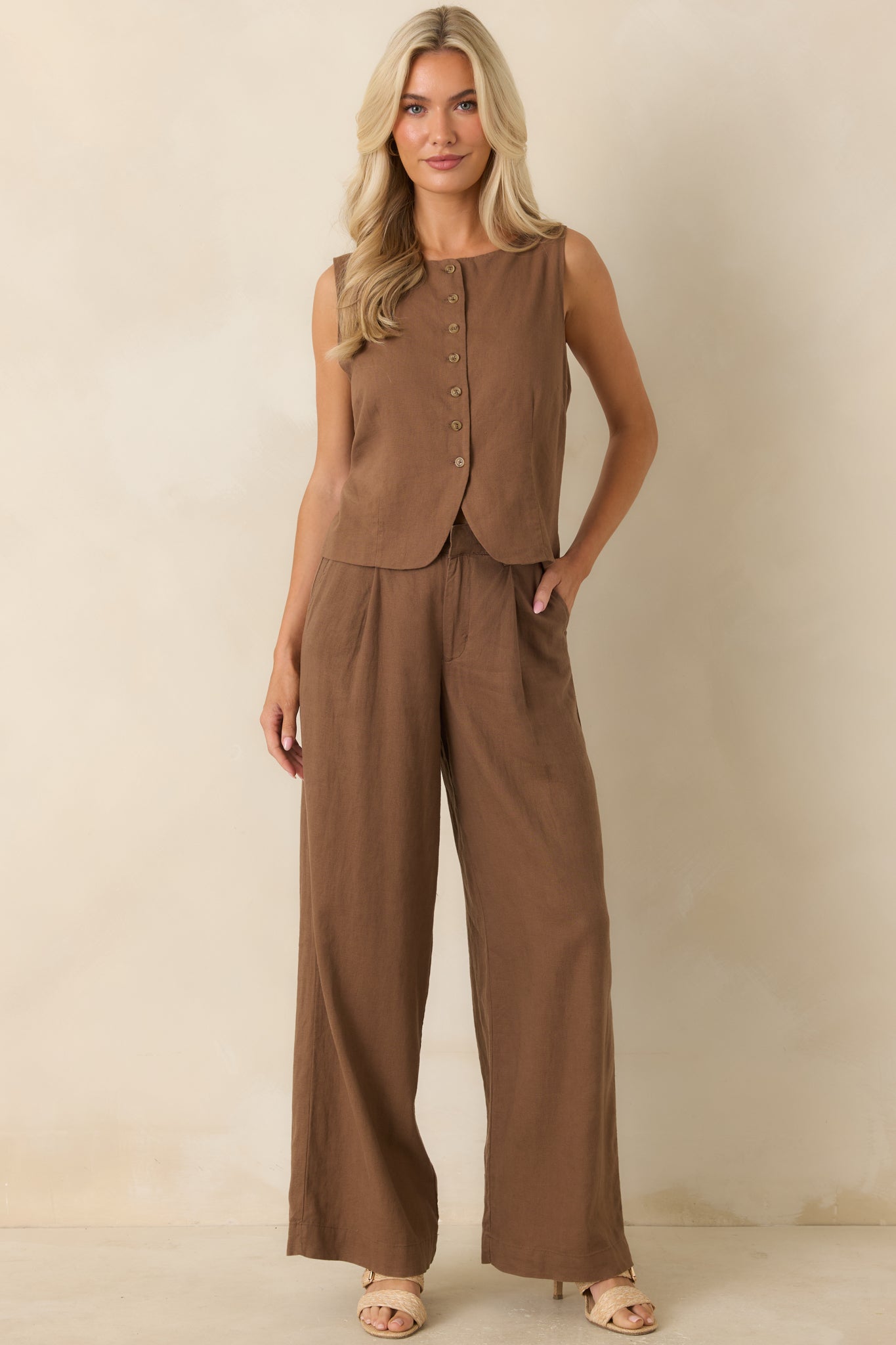 High-waisted chestnut pants with a sleek full-length cut, zip fly closure, and versatile polished style.