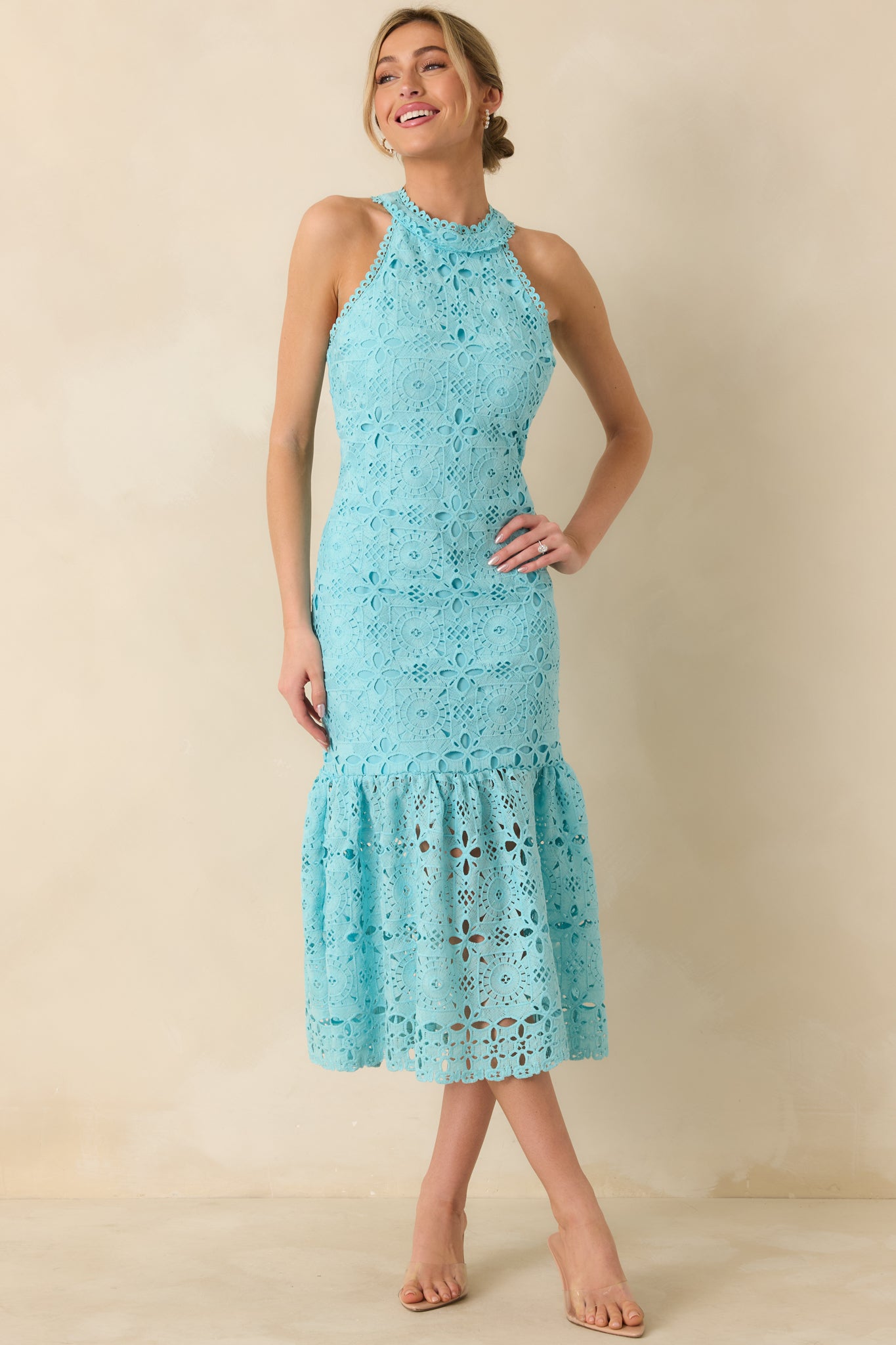 Angled front view highlighting fitted silhouette, embroidered bodice, and soft drape of the maxi skirt.