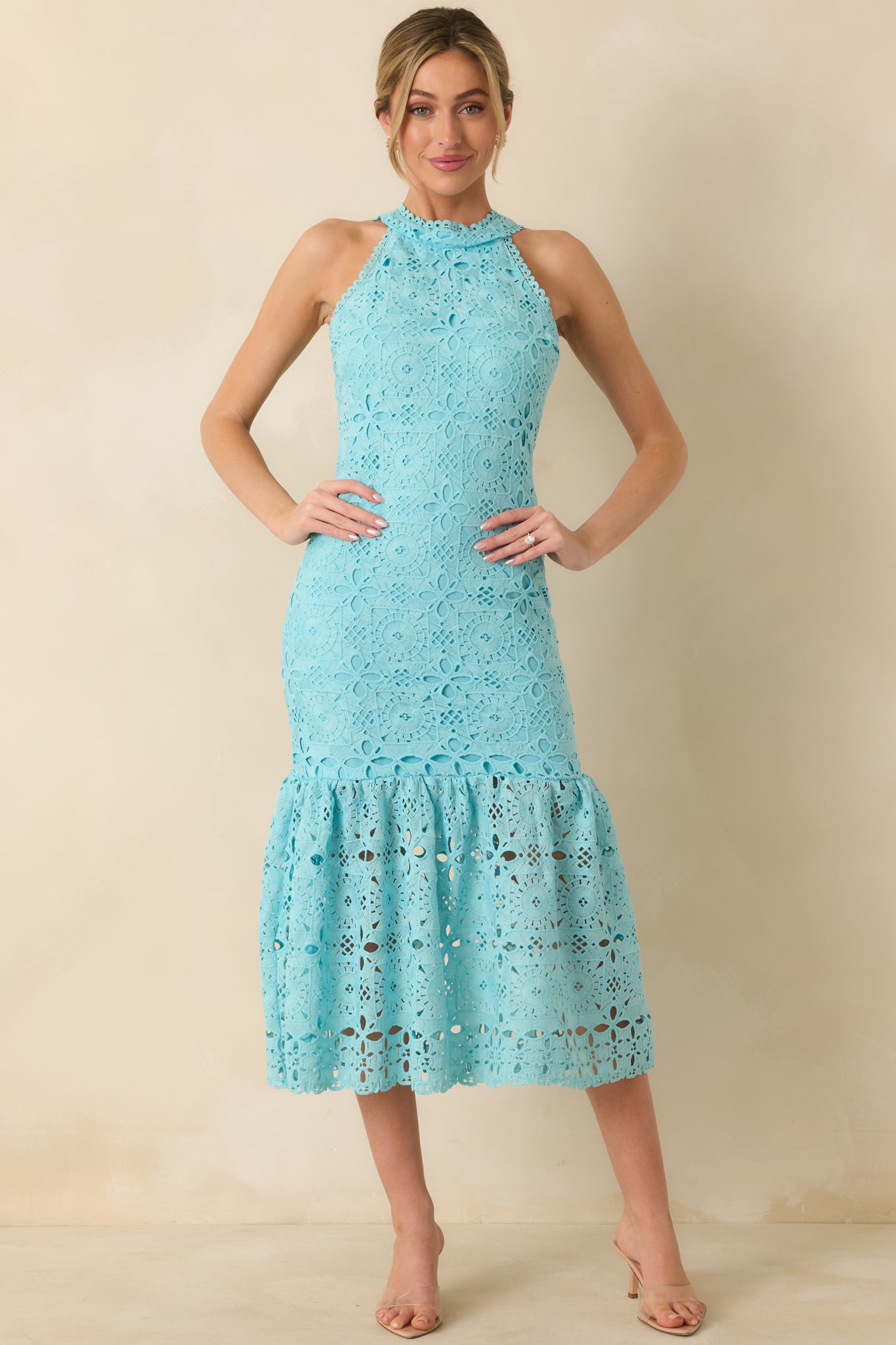 Front view of horizon blue maxi dress featuring halter neckline, geometric floral embroidery, and tiered flowy skirt.
