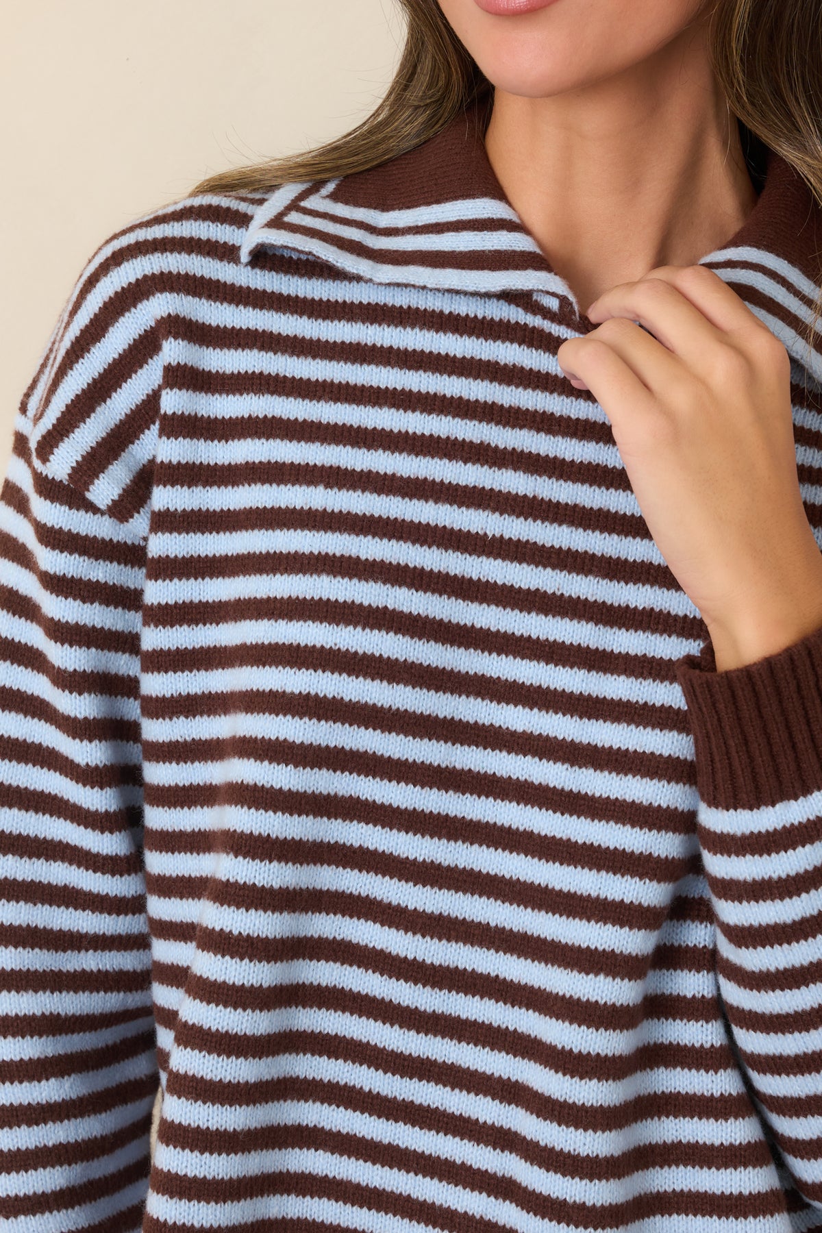 Close-up detail highlighting the horizontal stripes and chocolate brown ribbed polo collar.