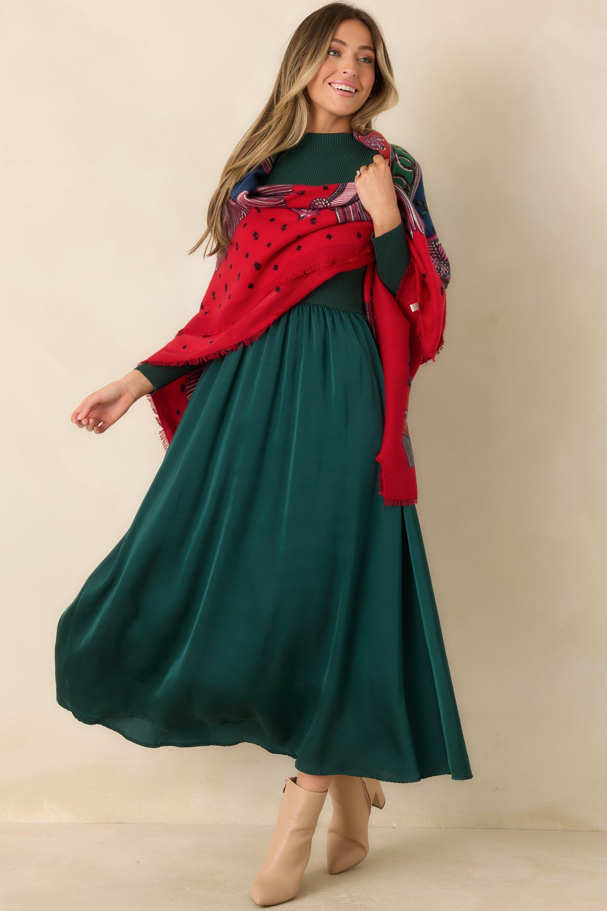 Hunter green long-sleeve dress with a subtle mock neck and a lustrous full-length skirt.