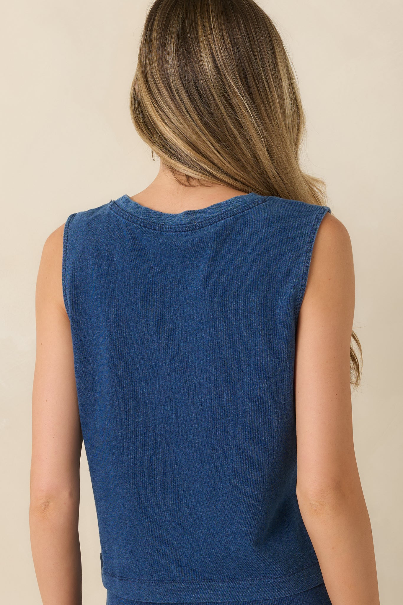 Back view of the indigo cotton tank featuring a relaxed fit and smooth jersey finish.