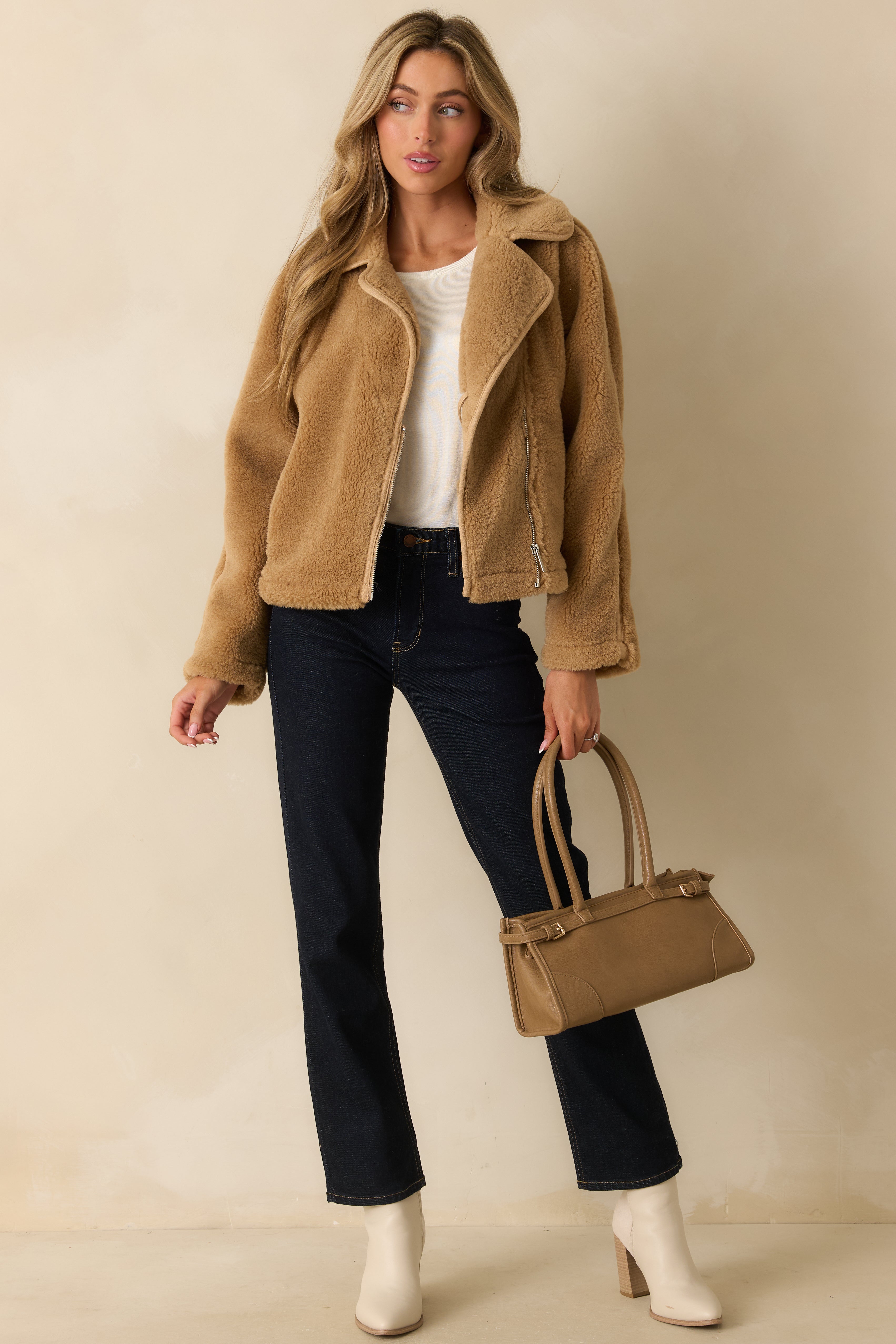 Deep indigo straight leg jeans highlighting the structured cotton-blend denim with subtle stretch and clean silhouette.